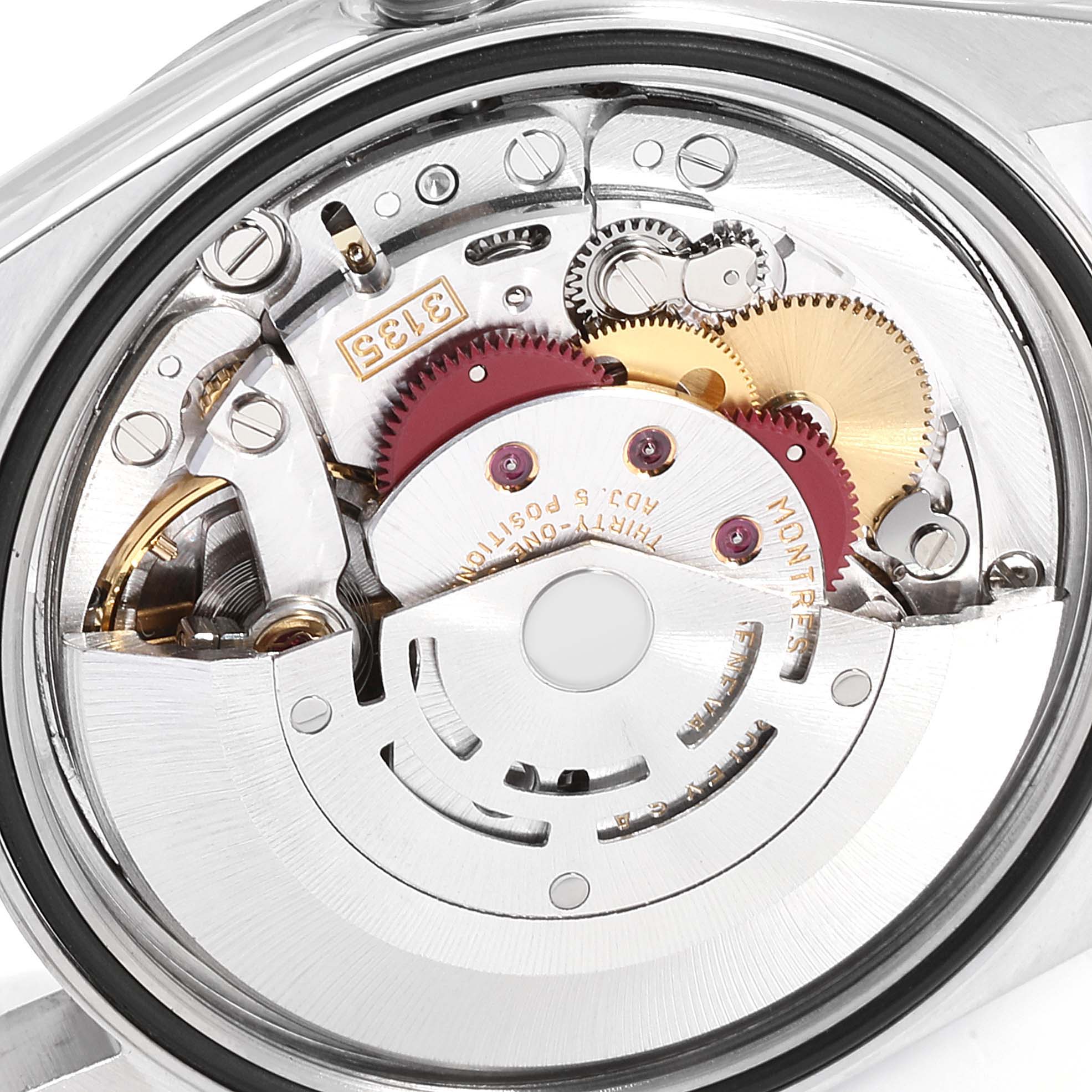 The image shows the intricate internal machinery and movement of the Rolex Datejust 16200  Men's Stainless Steel Silver Dial 16200  Men's Stainless Steel Silver Dial model from a rear angle.