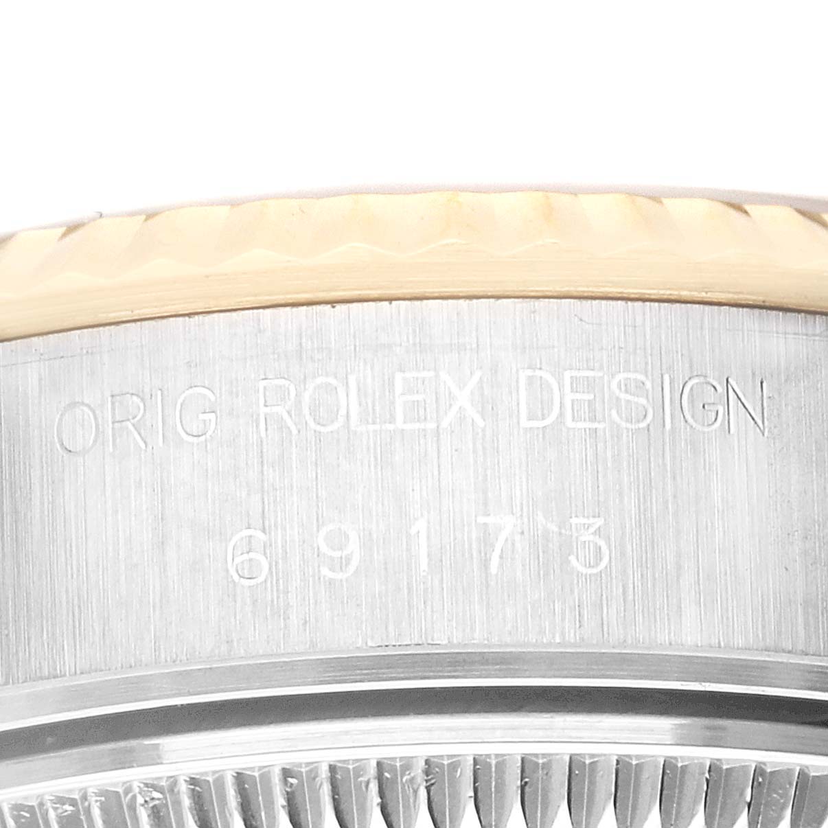 This image shows a close-up of the serial number and bezel edge of a Rolex Datejust 69173 Women's Steel and Gold (two tone) Champagne Dial 69173 Women's Steel and Gold (two tone) Champagne Dial watch.