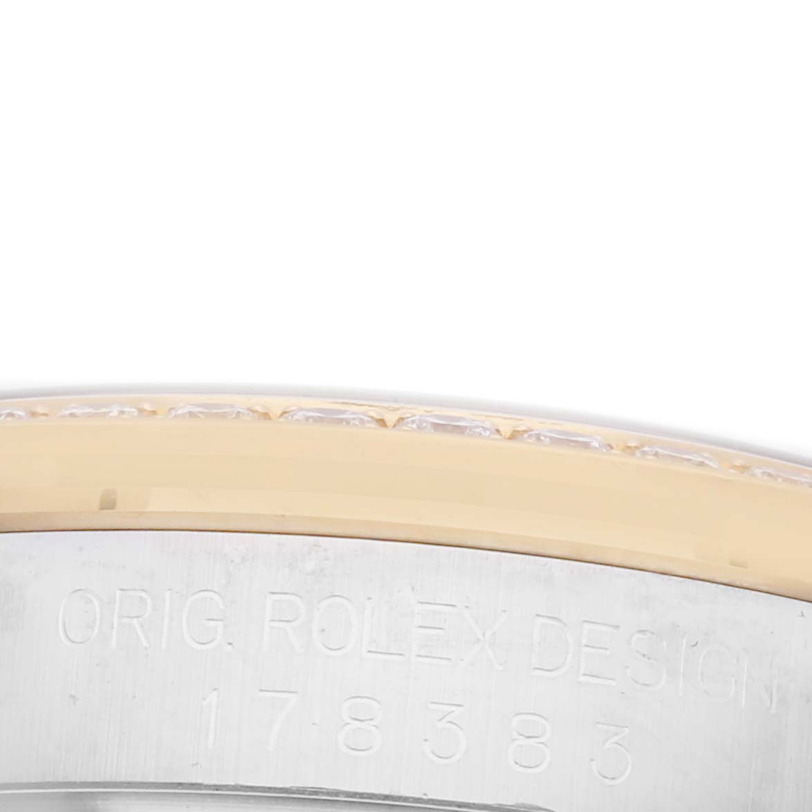 The image shows a close-up of the Rolex Mid-Size 178383 Women's Steel and Gold (two tone) Black Dial 178383 Women's Steel and Gold (two tone) Black Dial model's bezel with a diamond setting and "ORIG. ROLEX DESIGN" engraving.