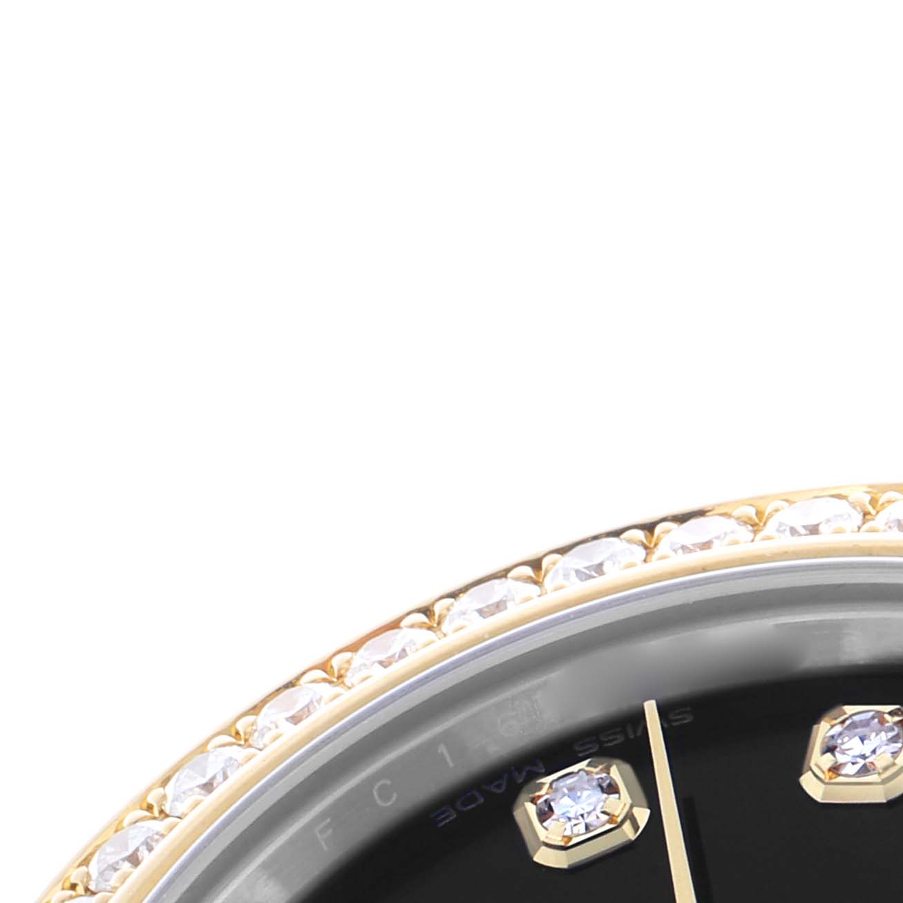 The image shows a close-up of the bezel with gems and part of the dial of a Rolex Mid-Size 178383 Women's Steel and Gold (two tone) Black Dial 178383 Women's Steel and Gold (two tone) Black Dial model.