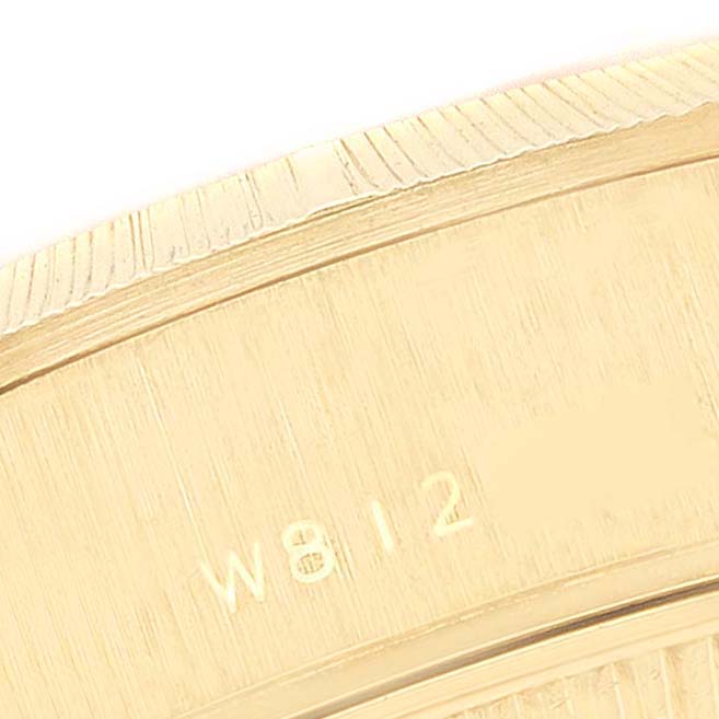This image shows a close-up of the side engraving and bezel detail of a Rolex President 69278 Women
s Yellow Gold Champagne Dial 69278 Women
s Yellow Gold Champagne Dial model watch.