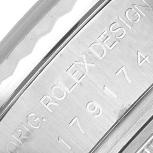 The image shows a close-up of the engraved side of a Rolex Datejust 179174 Women's Stainless Steel Mother of Pearl Dial 179174 Women's Stainless Steel Mother of Pearl Dial watch, displaying "ORIG. ROLEX DESIGN."