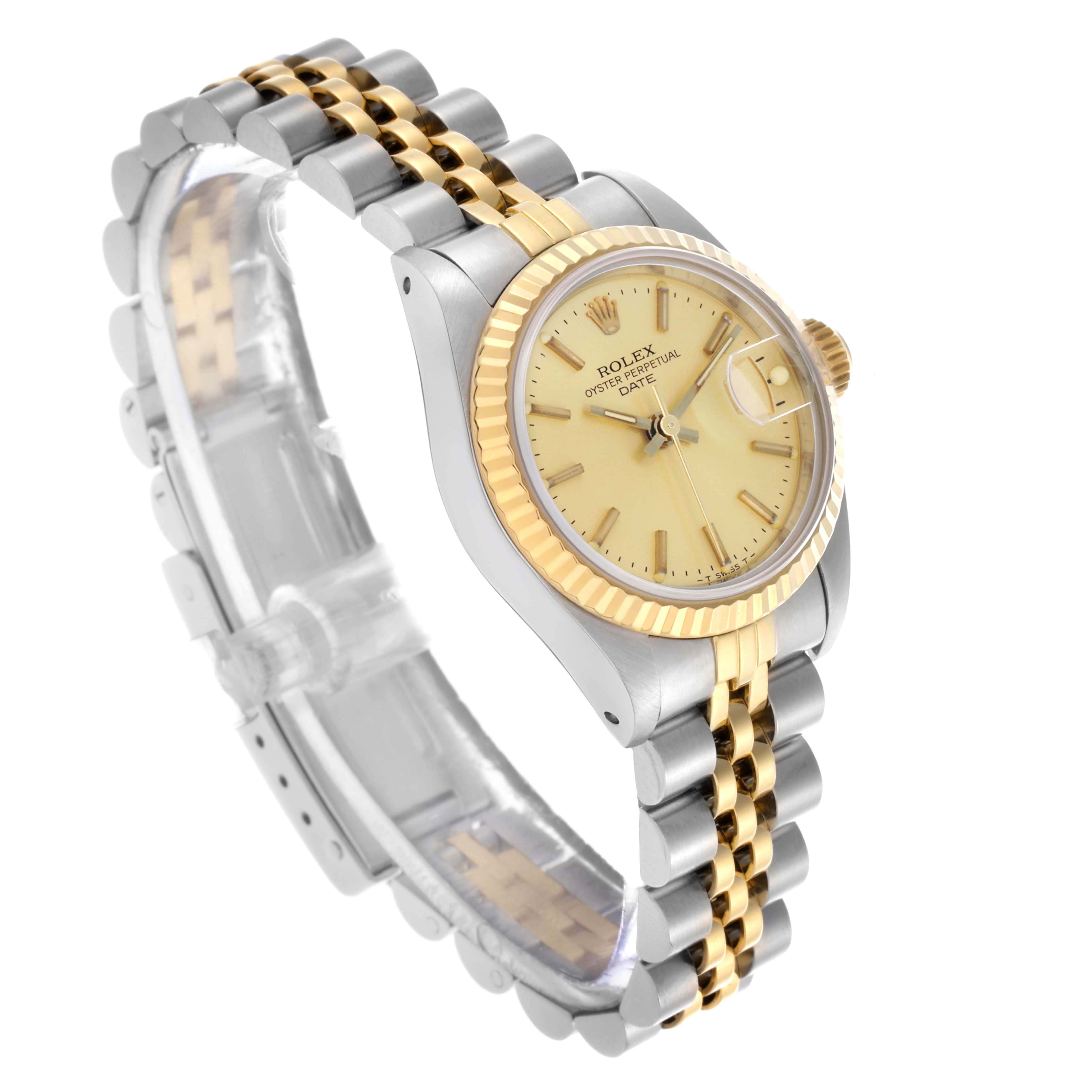The Rolex Datejust 69173 Women's Steel and Gold (two tone) Champagne Dial 69173 Women's Steel and Gold (two tone) Champagne Dial watch is shown at a side angle, displaying the dial, fluted bezel, and jubilee bracelet.