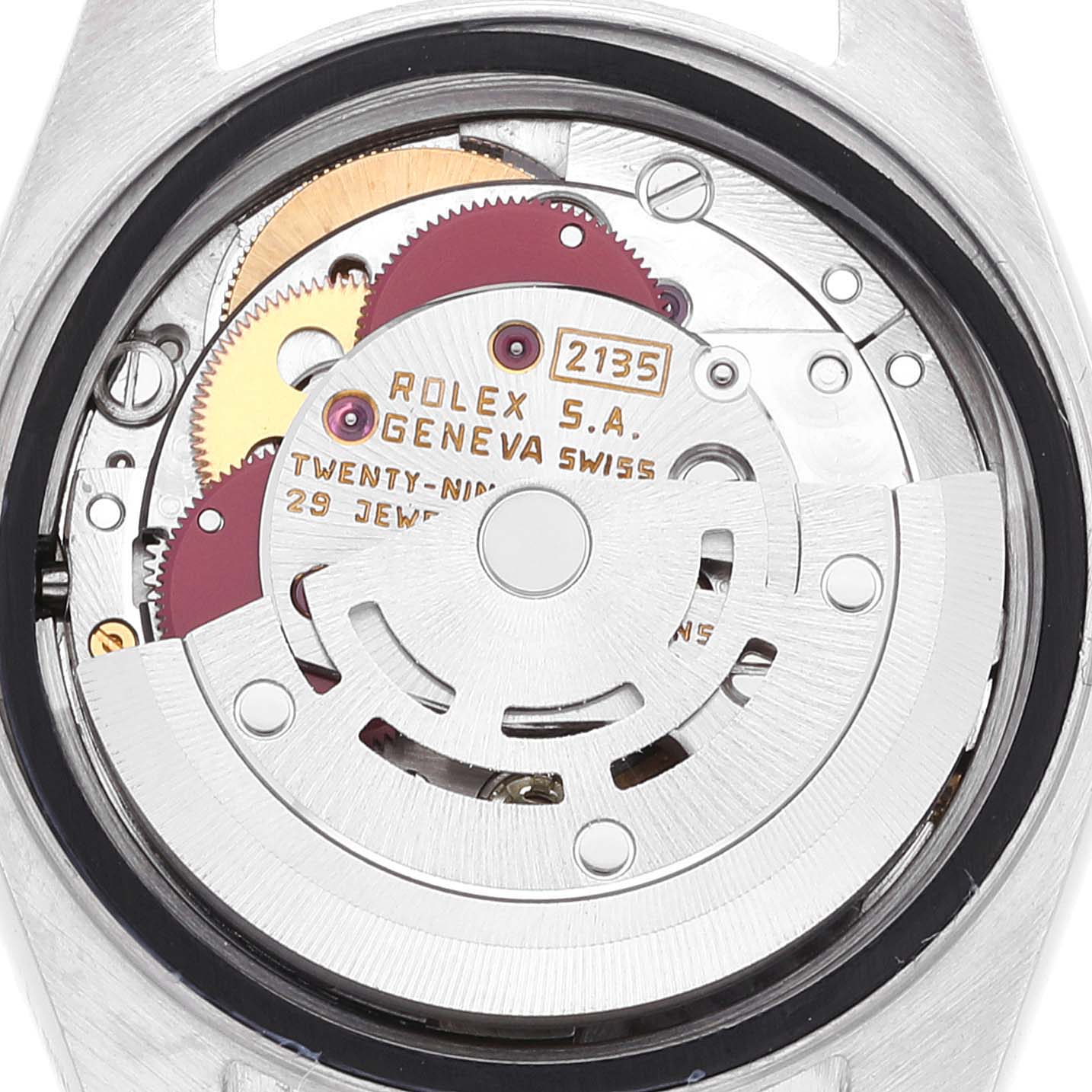 The image shows the internal mechanism of a Rolex Datejust 69173 Women's Steel and Gold (two tone) Champagne Dial 69173 Women's Steel and Gold (two tone) Champagne Dial watch, focusing on its rotor, gears, and movement components.
