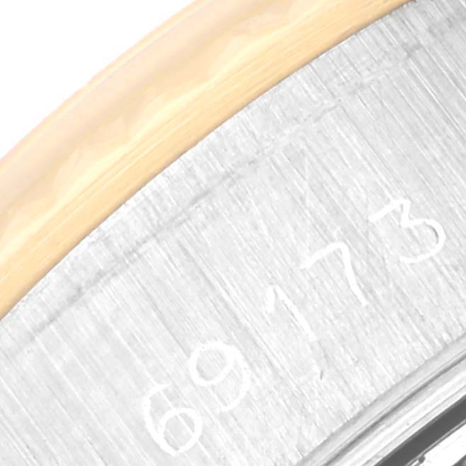 This is a close-up of the side bezel and part of the serial number on a Rolex Datejust 69173 Women's Steel and Gold (two tone) Champagne Dial 69173 Women's Steel and Gold (two tone) Champagne Dial watch.