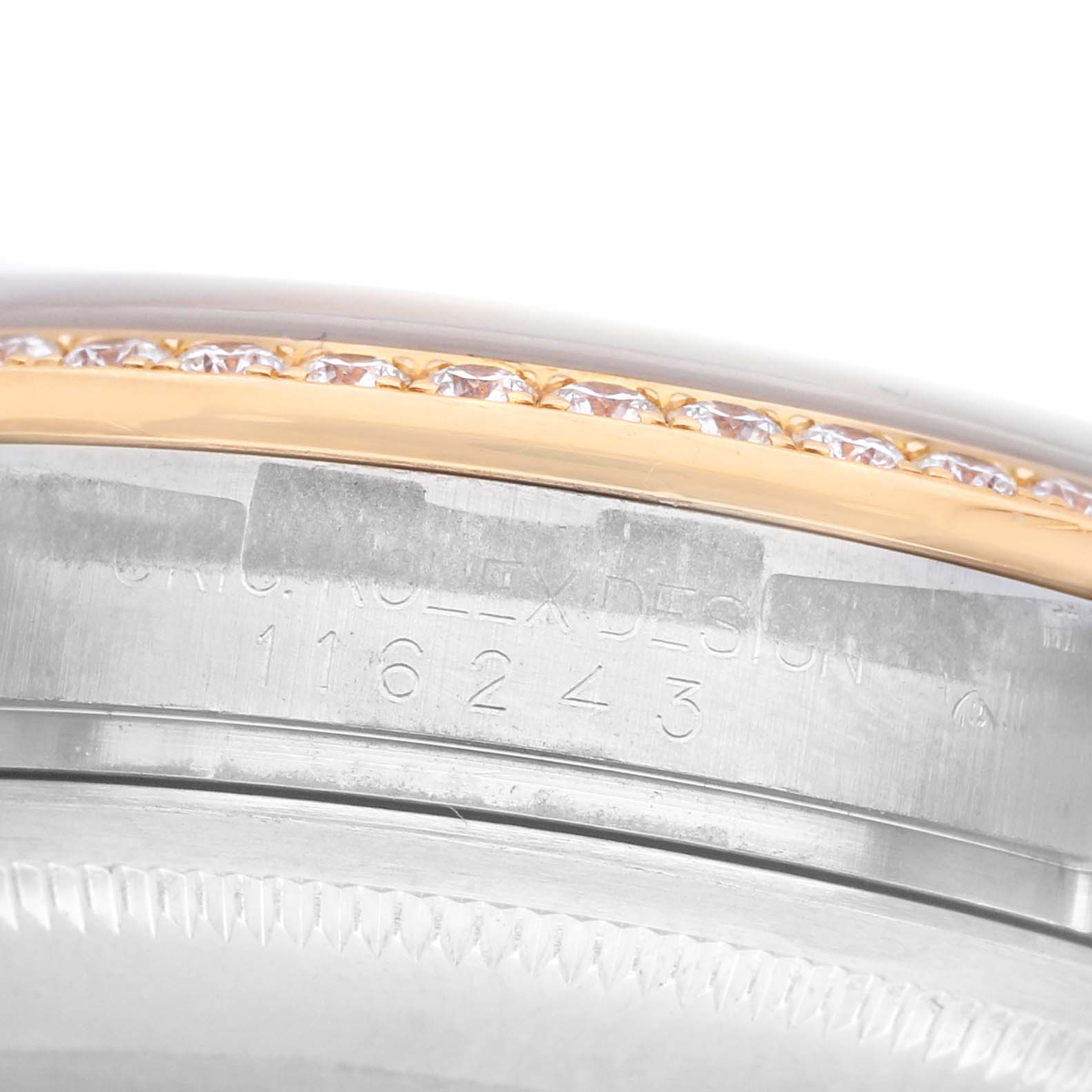 The image shows a close-up of the bezel and case side of a Rolex Datejust 116243 Men's Steel and Gold (two tone) Mother of Pearl Dial, with engraved serial numbers visible.
