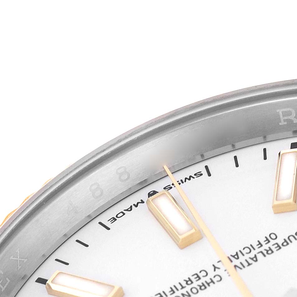 The image shows a close-up of the Rolex Datejust 126233 Men's Steel and Gold (two tone) White Dial watch, detailing the dial, hands, hour markers, and part of the bezel.