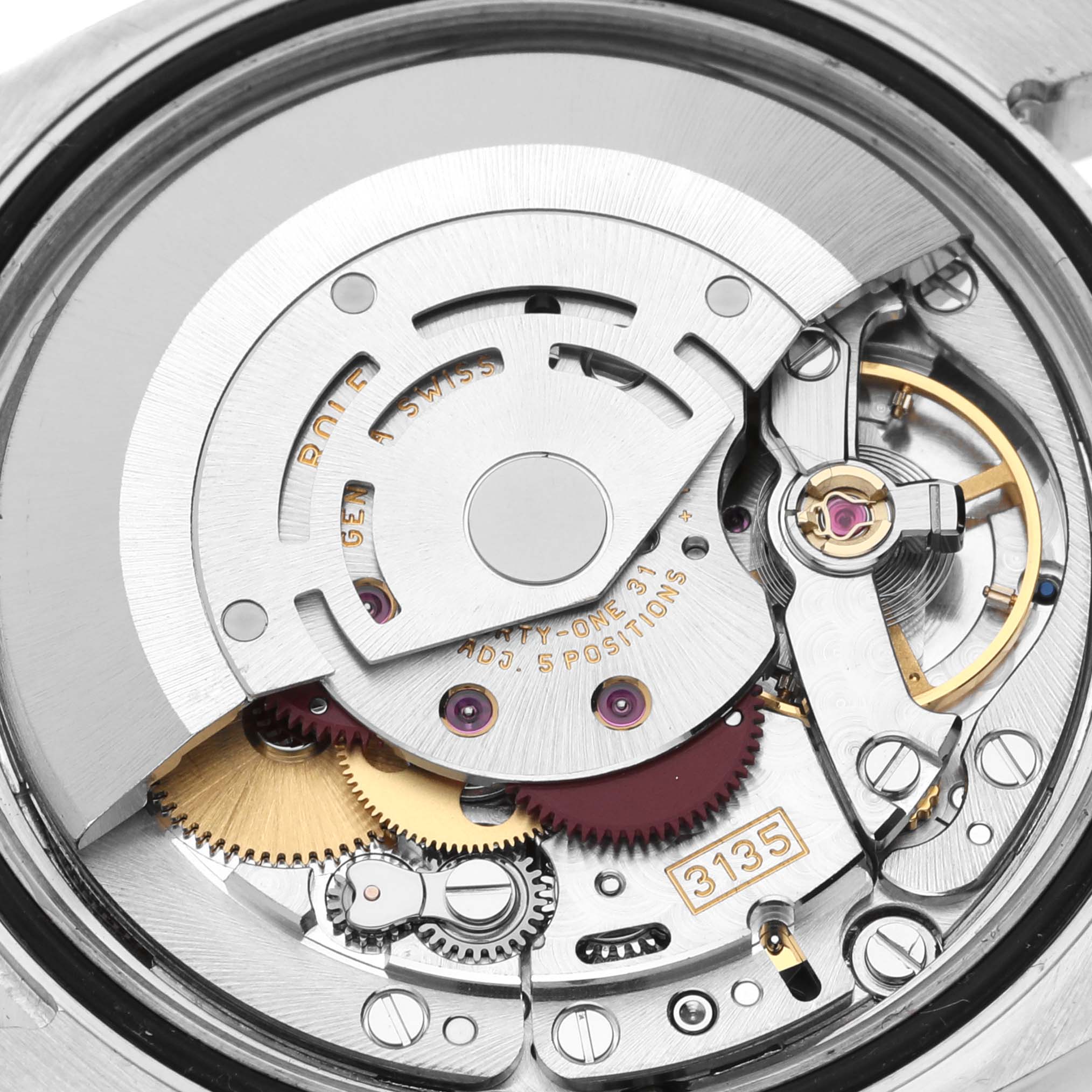 The image shows the intricate internal mechanism of the Rolex Turn-o-Graph 116261 Men
s Steel and Gold (two tone) Silver Dial 116261 Men
s Steel and Gold (two tone) Silver Dial watch, focusing on its caliber 3135 movement.