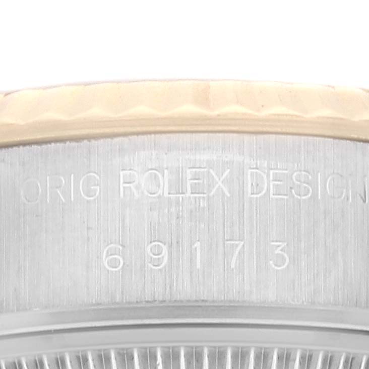 This image shows a close-up view of the side of a Rolex Datejust 69173 Women's Steel and Gold (two tone) Champagne Dial 69173 Women's Steel and Gold (two tone) Champagne Dial watch with the reference number 69173 engraved.
