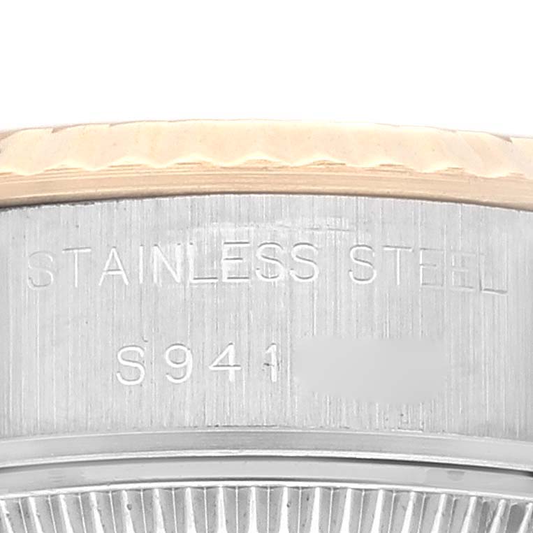 This close-up angled image shows the side of the case with engravings on a Rolex Datejust 69173 Women's Steel and Gold (two tone) Champagne Dial 69173 Women's Steel and Gold (two tone) Champagne Dial watch.