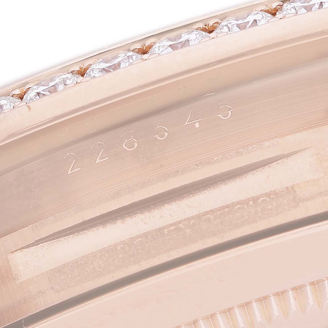 The image shows a close-up of the Rolex President 228345 Men's Rose Gold Brown Dial model bezel with diamond accents and engraved numbers.