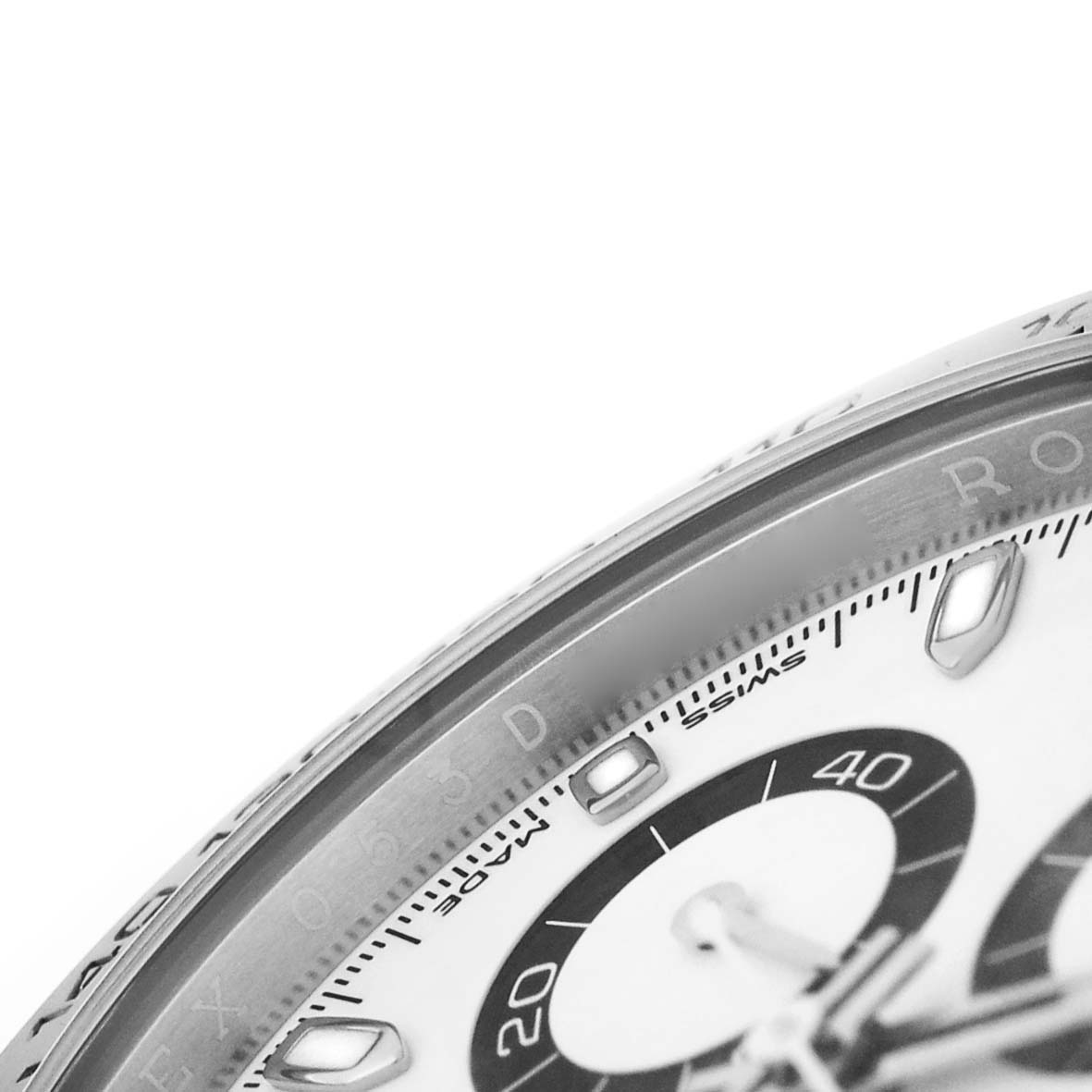 The image shows a close-up of the dial and bezel of a Rolex Daytona 116500LN Men's Stainless Steel White Dial watch at an angle.