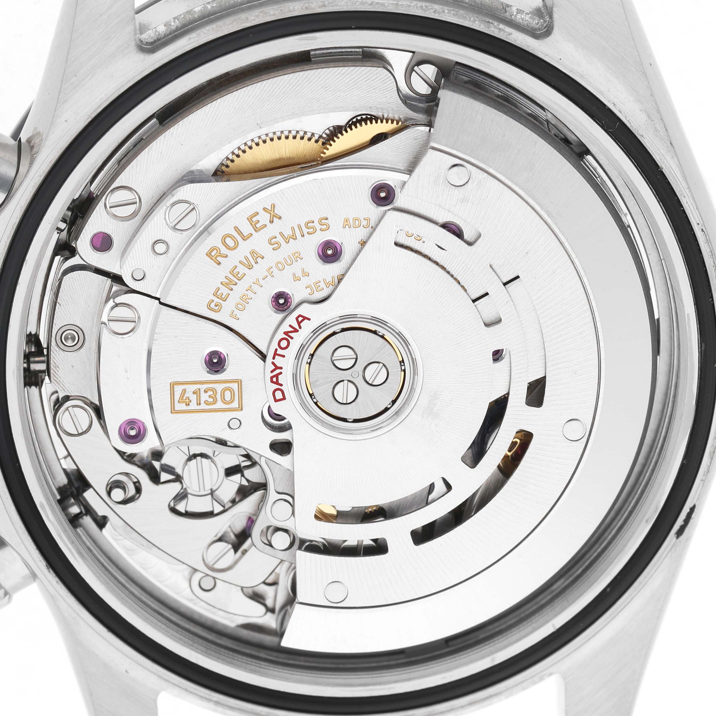The image shows the back view of a Rolex Daytona 116500LN Men's Stainless Steel White Dial watch, focusing on its intricate movement components.