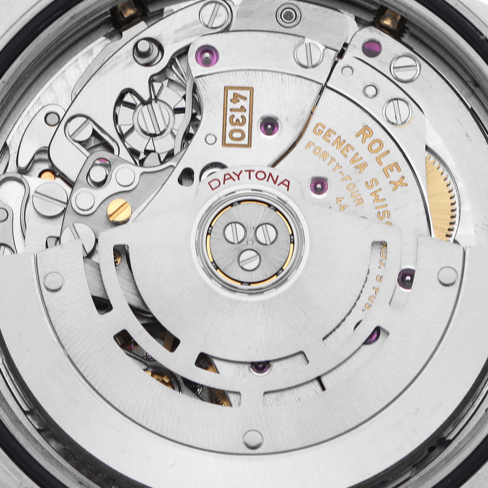 The image shows the movement of a Rolex Daytona 116503 Men's Steel and Gold (two tone) Mother of Pearl Dial 116503 Men's Steel and Gold (two tone) Mother of Pearl Dial, highlighting gears and engravings from the back view.