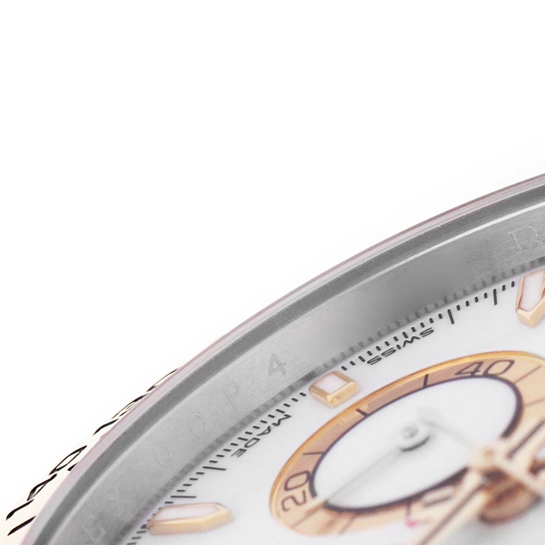 The image shows a close-up of the bezel and part of the dial of a Rolex Daytona 126503 Men's Steel and Gold (two tone) White Dial, focusing on markers and chronograph details.