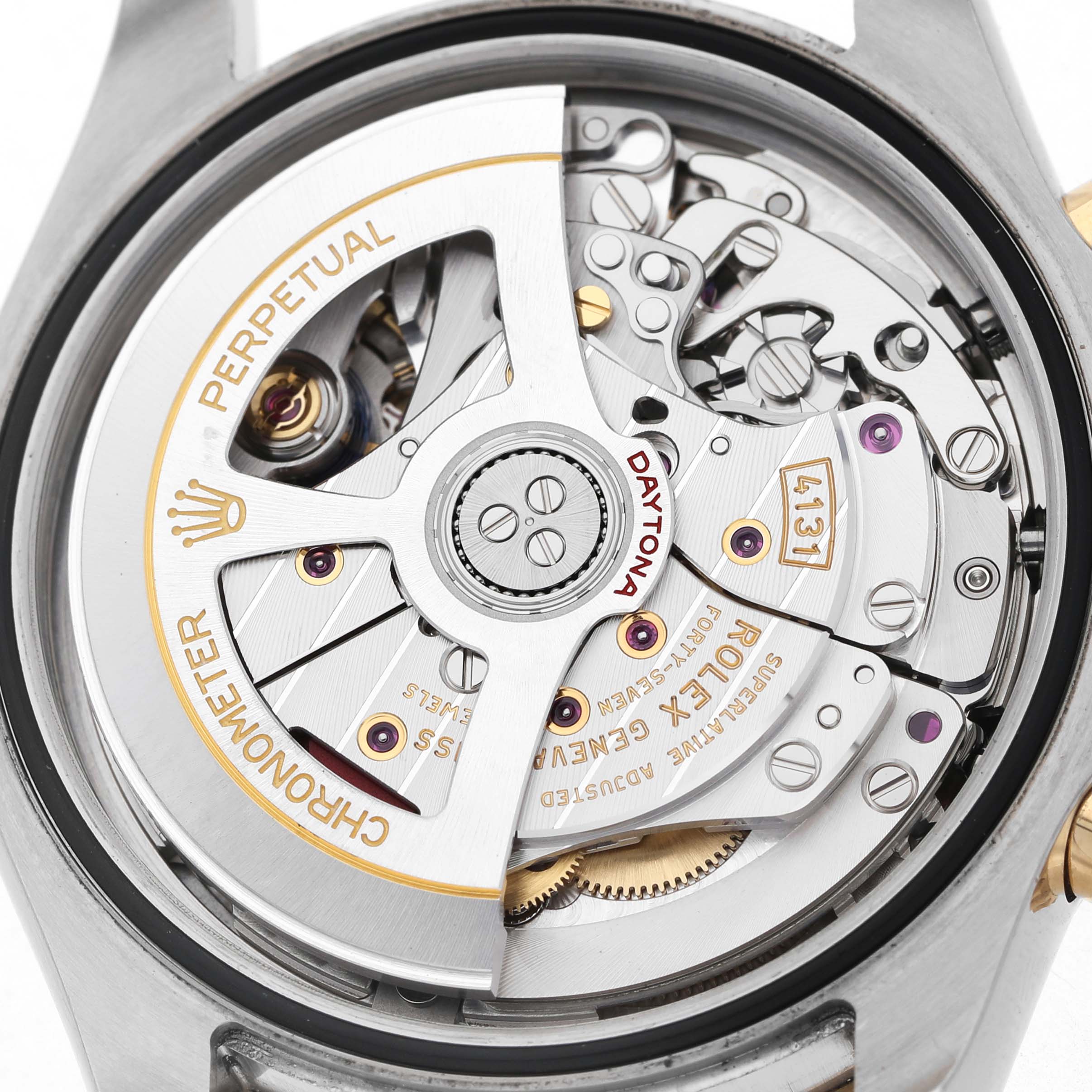 The image shows the movement of a Rolex Daytona 126503 Men's Steel and Gold (two tone) White Dial watch, displaying the rotor and intricate components from a rear view.