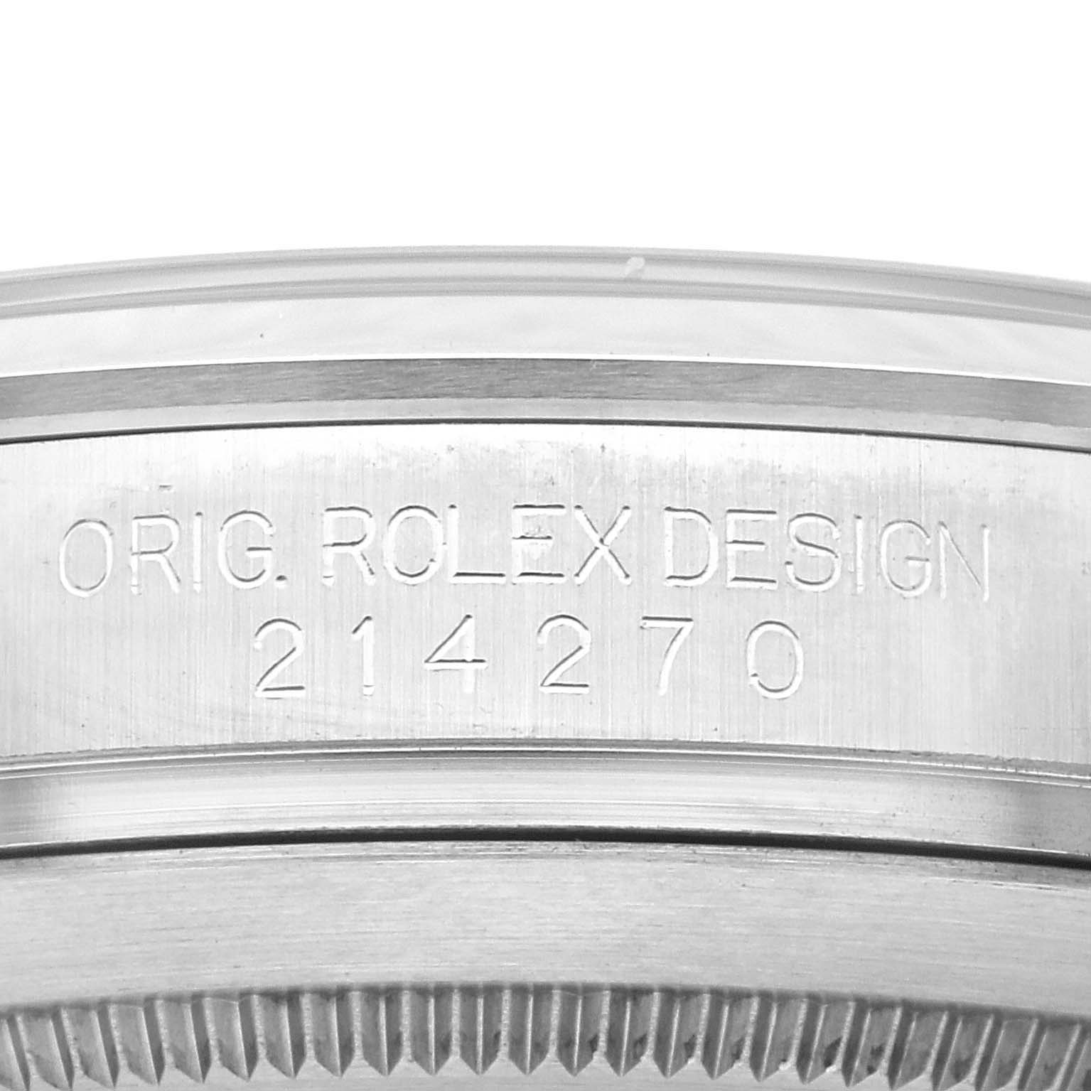 The image shows a close-up view of the Rolex Explorer 214270 Men
s Stainless Steel Black Dial 214270 Men
s Stainless Steel Black Dial model
s case, specifically the engravings on the side.