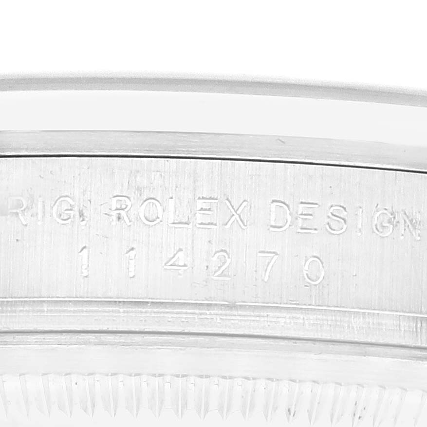 This image shows a close-up of the side of a Rolex Explorer 114270 Men
s Stainless Steel Black Dial 114270 Men
s Stainless Steel Black Dial watch case, highlighting the engraved model number.