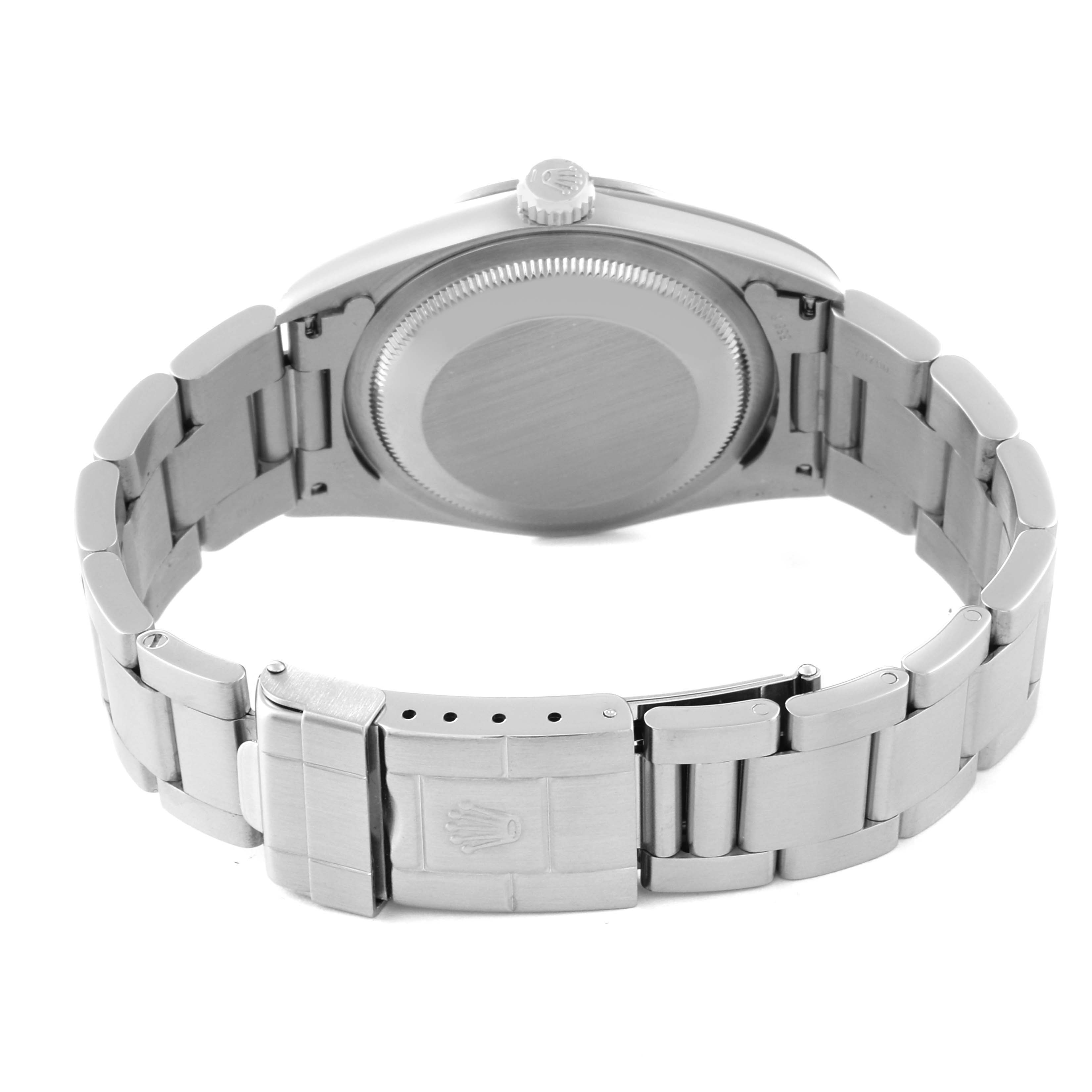 The image shows the back view of a Rolex Explorer 14270 Men
s Stainless Steel Black Dial 14270 Men
s Stainless Steel Black Dial watch, highlighting the case back and bracelet with a clasp.