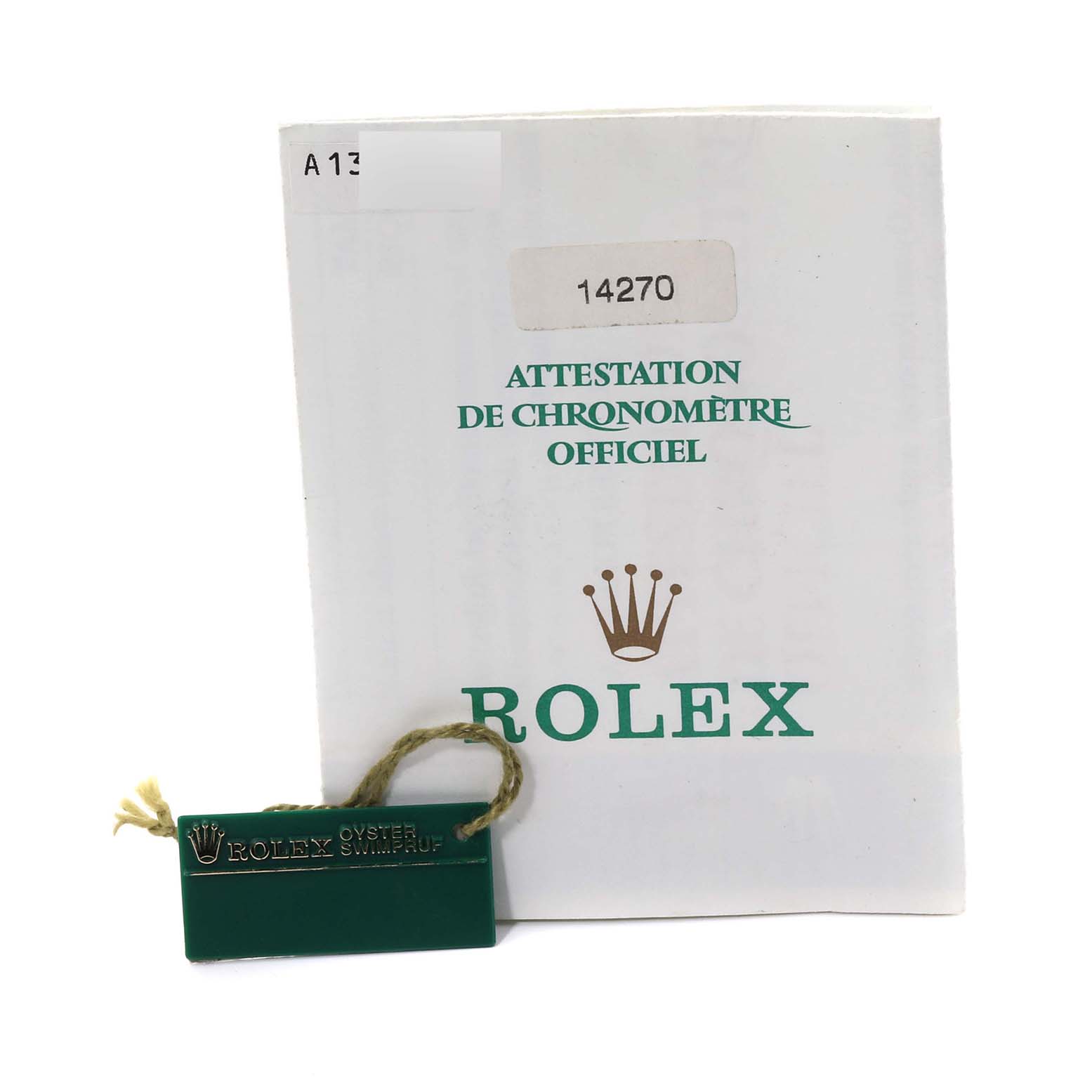 The image shows the documentation and tag for a Rolex Explorer 14270 Men
s Stainless Steel Black Dial 14270 Men
s Stainless Steel Black Dial model.