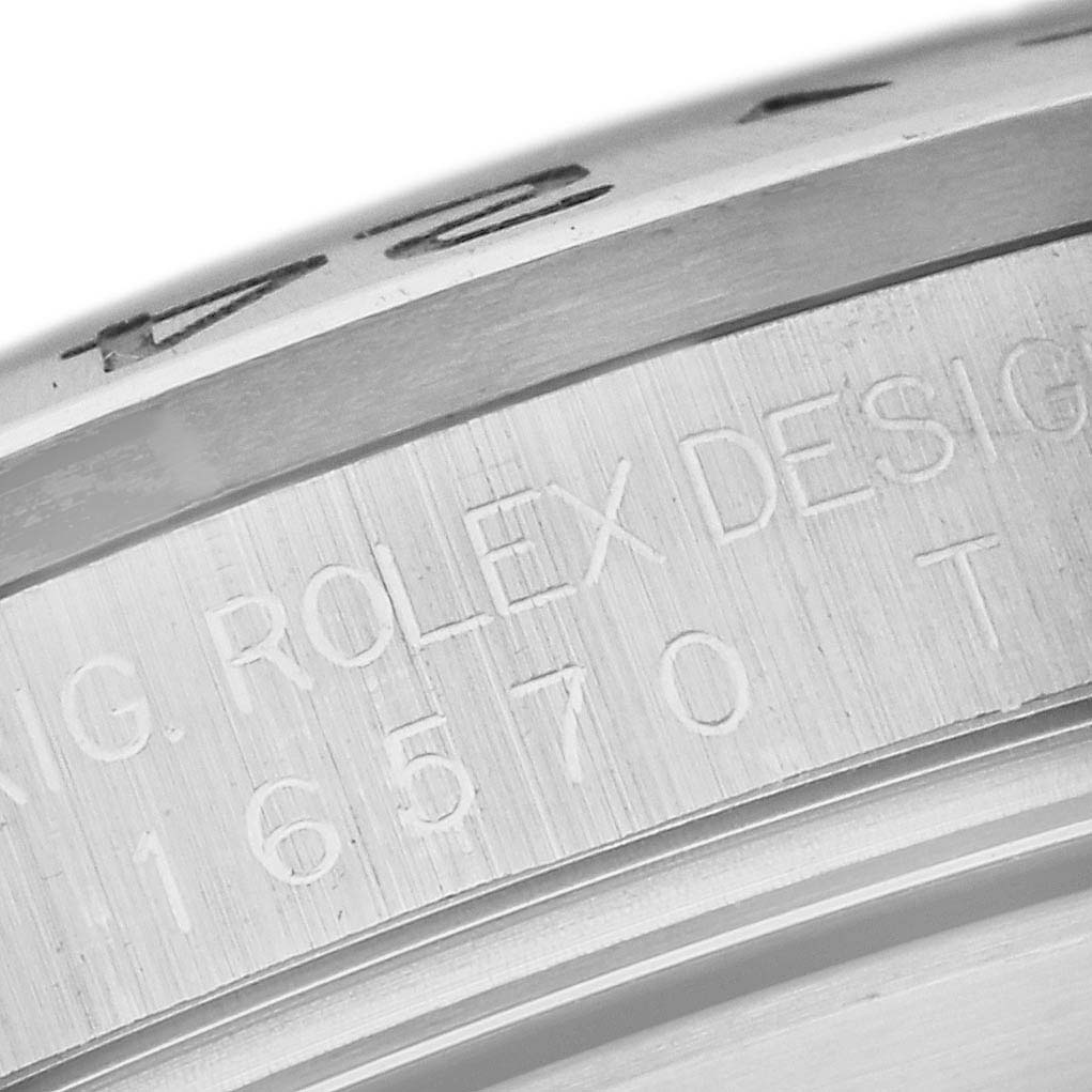 The image shows a close-up of the engraved serial number and design details on the case side of a Rolex Explorer 16570T Men's Stainless Steel White Dial 16570T Men's Stainless Steel White Dial watch.
