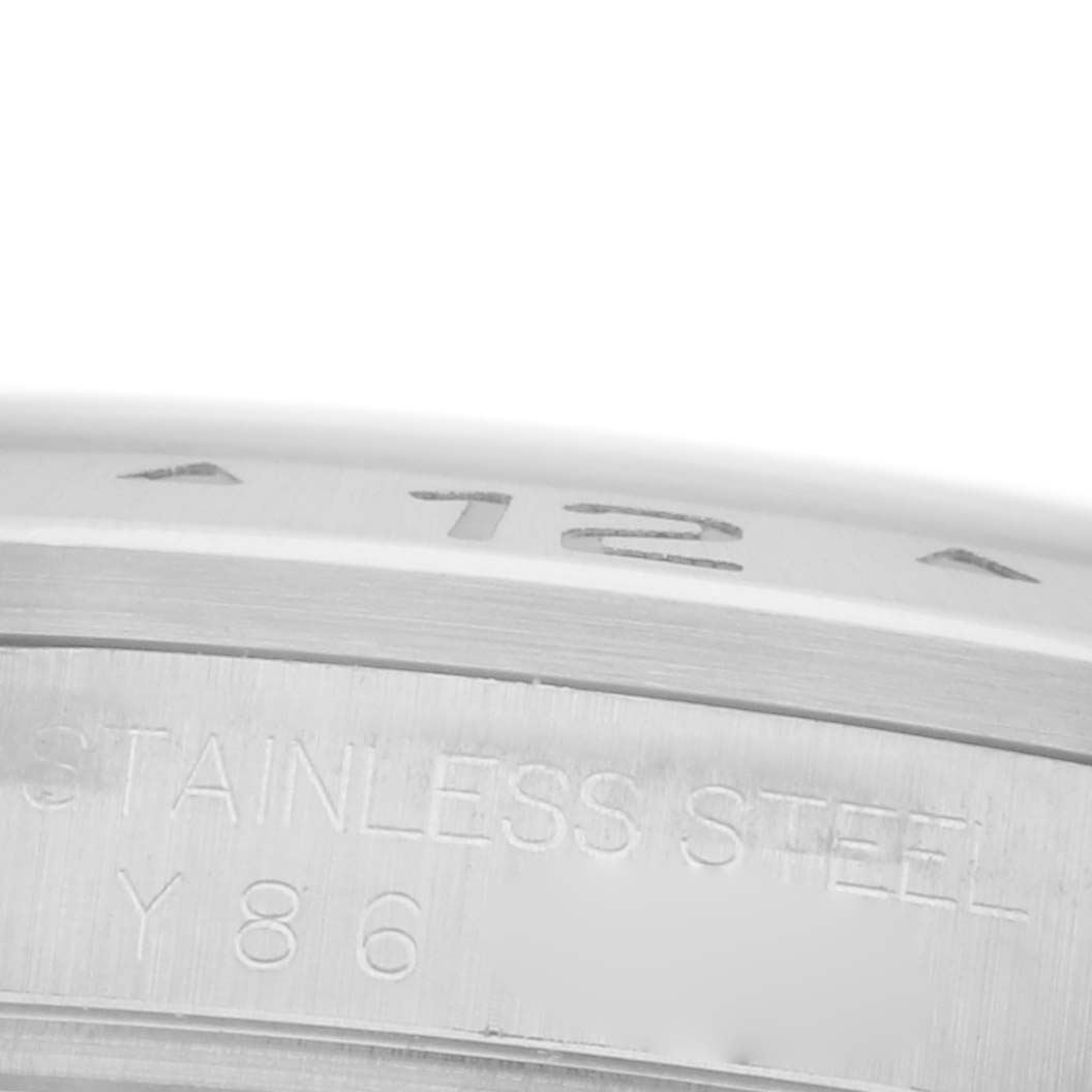 The image shows a close-up of the bezel and case rim of a Rolex Explorer 16570T Men's Stainless Steel Black Dial 16570T Men's Stainless Steel Black Dial, highlighting stainless steel engravings.