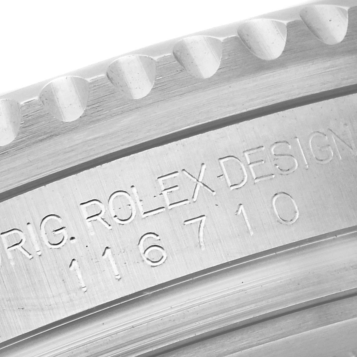 This close-up image shows the edge and model engraving of the bezel of a Rolex GMT-Master 116710BLNR Men's Stainless Steel Black Dial 116710BLNR Men's Stainless Steel Black Dial watch, showcasing the reference number 116710.