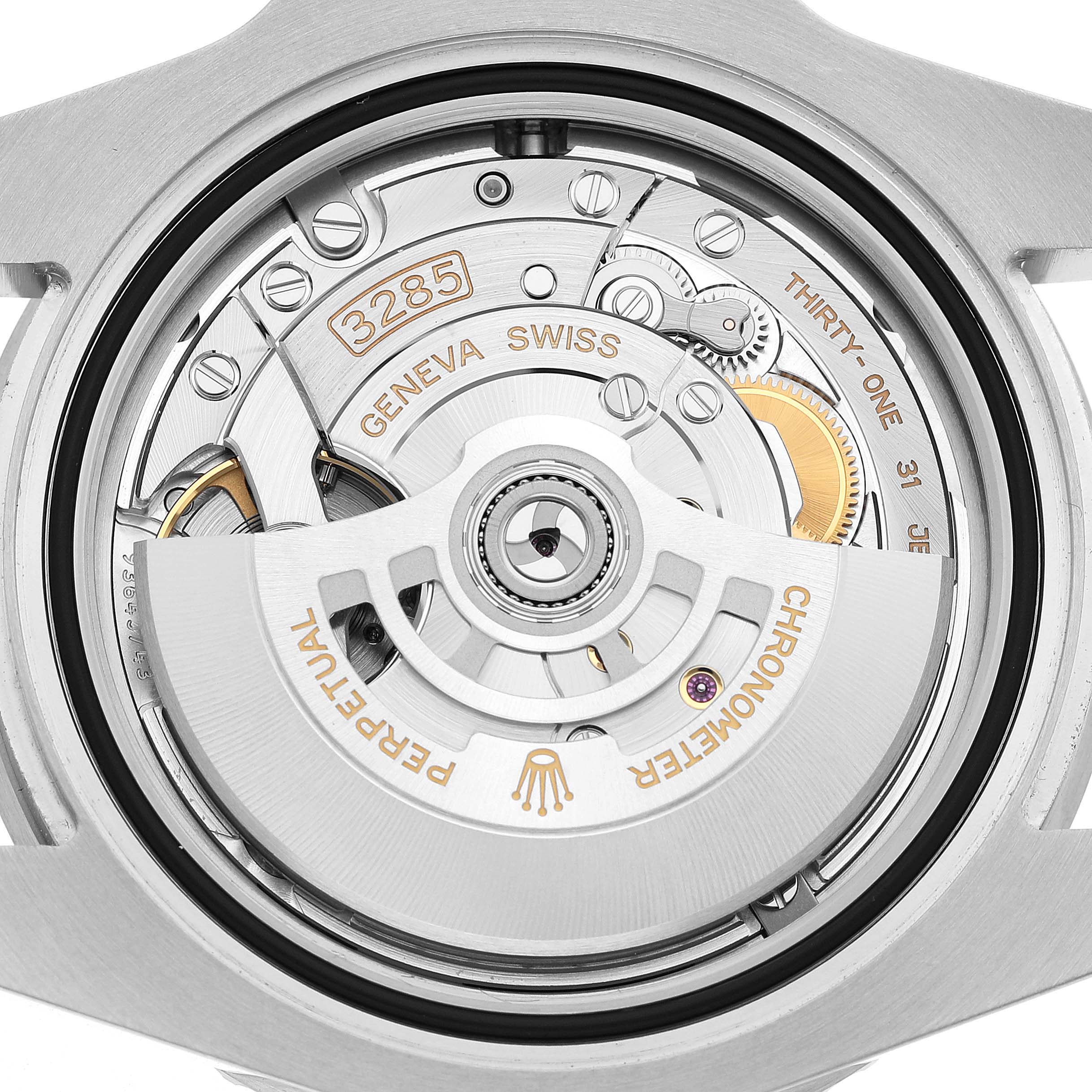 The image shows the movement of a Rolex GMT-Master 126710GRNR Men's Stainless Steel Black Dial, highlighting its intricate mechanical components from the back.