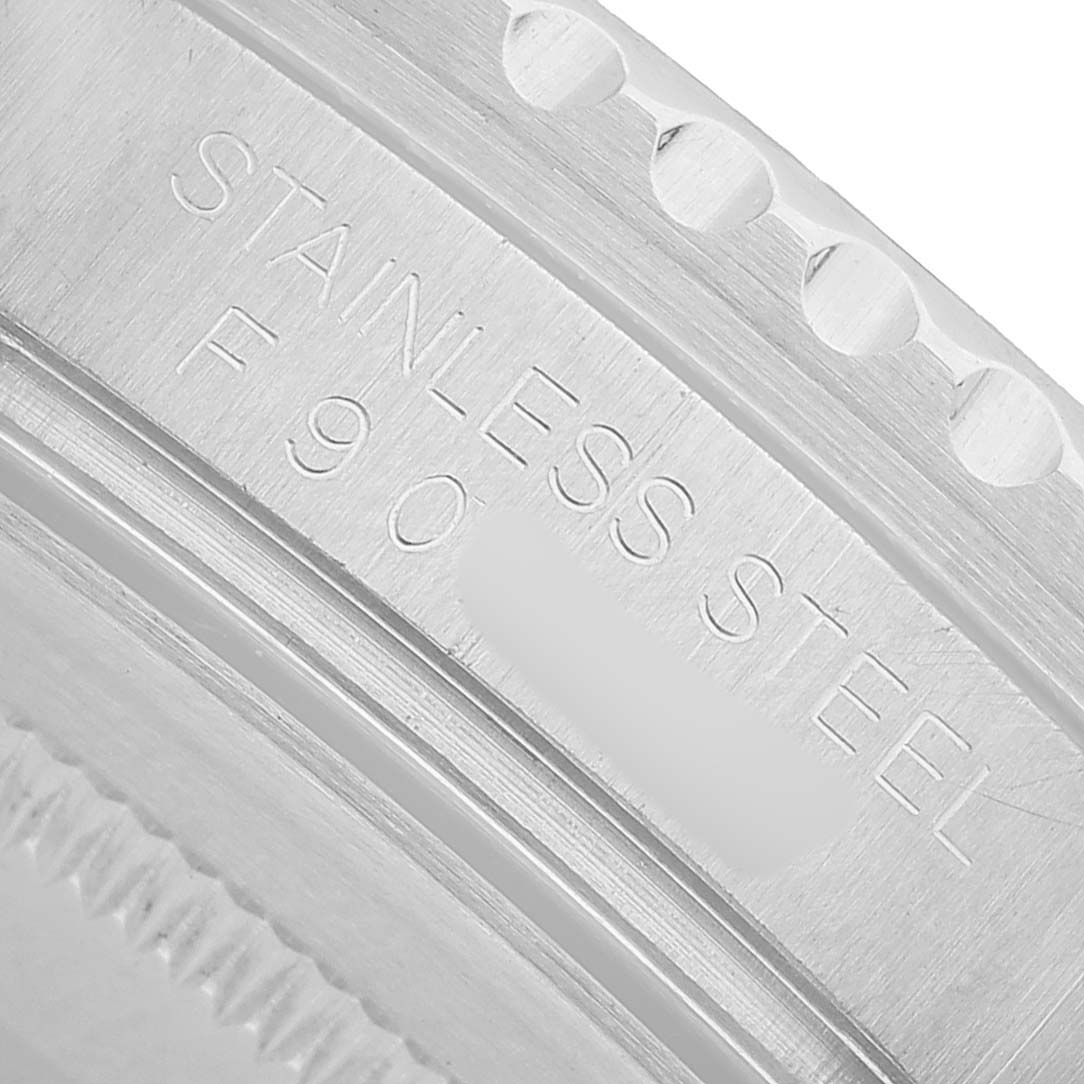 The image shows a close-up of the side of a Rolex GMT-Master 16710 Men's Stainless Steel Black Dial, highlighting the stainless steel engraving.