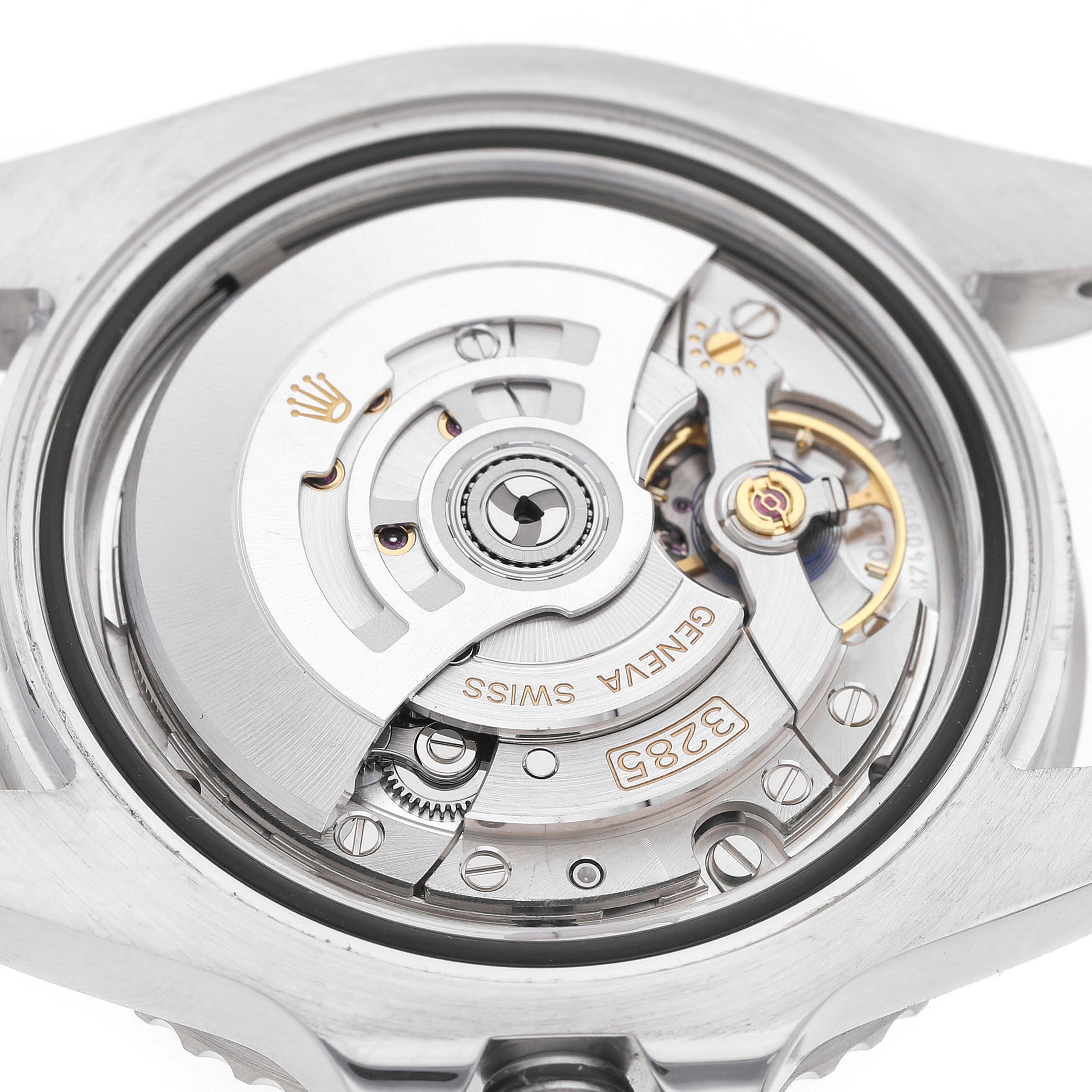 The image shows the Rolex GMT-Master 126710BLRO Men's Stainless Steel Black Dial's movement from the back, highlighting its rotor and intricate mechanics.