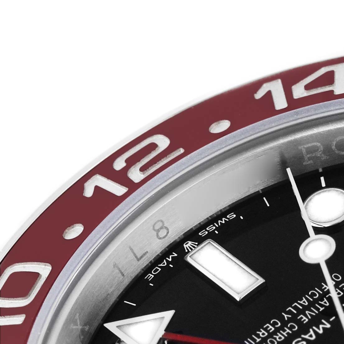The image shows a close-up of the bezel and part of the dial on a Rolex GMT-Master 126710BLRO Men's Stainless Steel Black Dial, highlighting the "12" and "14" markers.