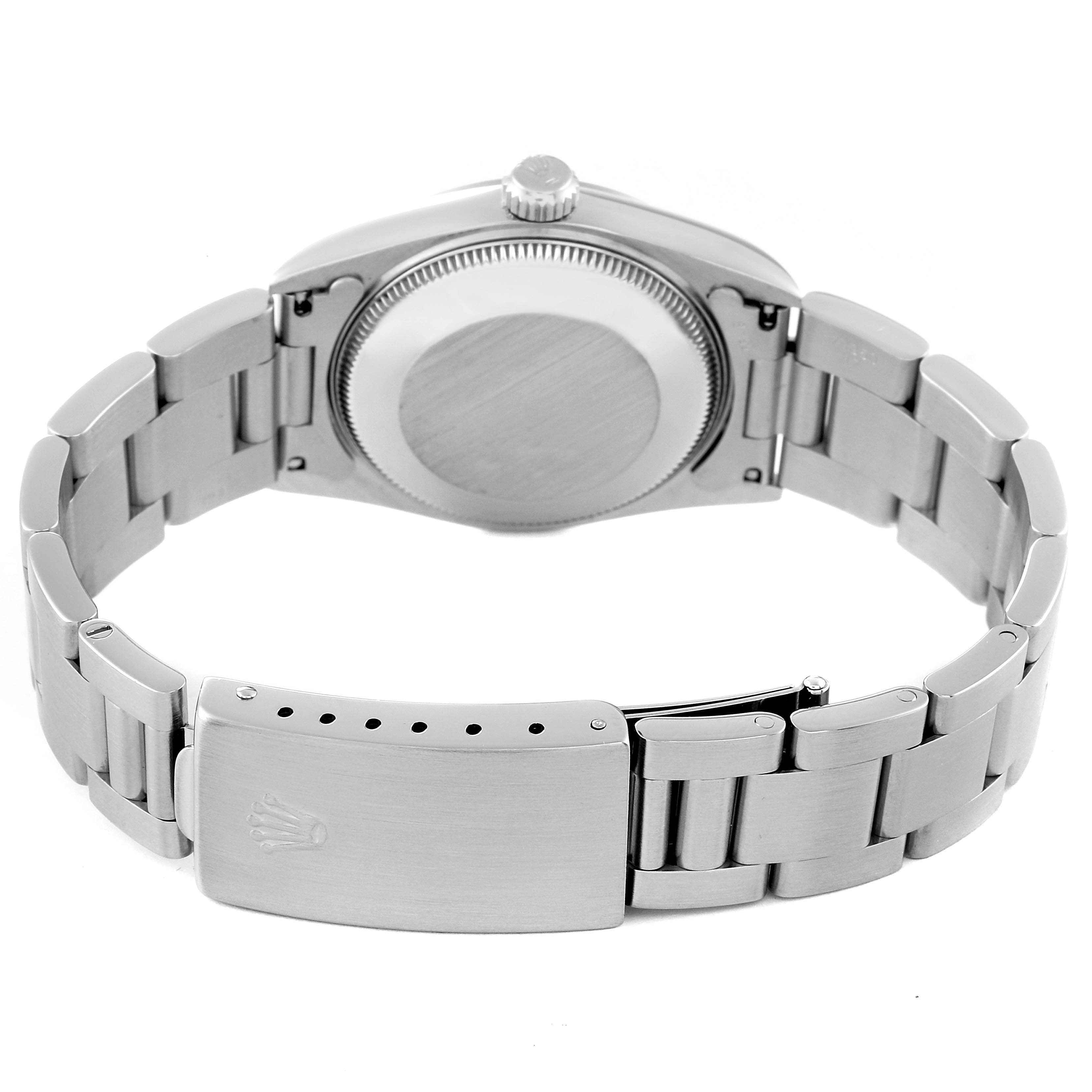 The image shows the back and bracelet with the clasp of a Mid-Size Rolex watch, viewed from a rear angle.