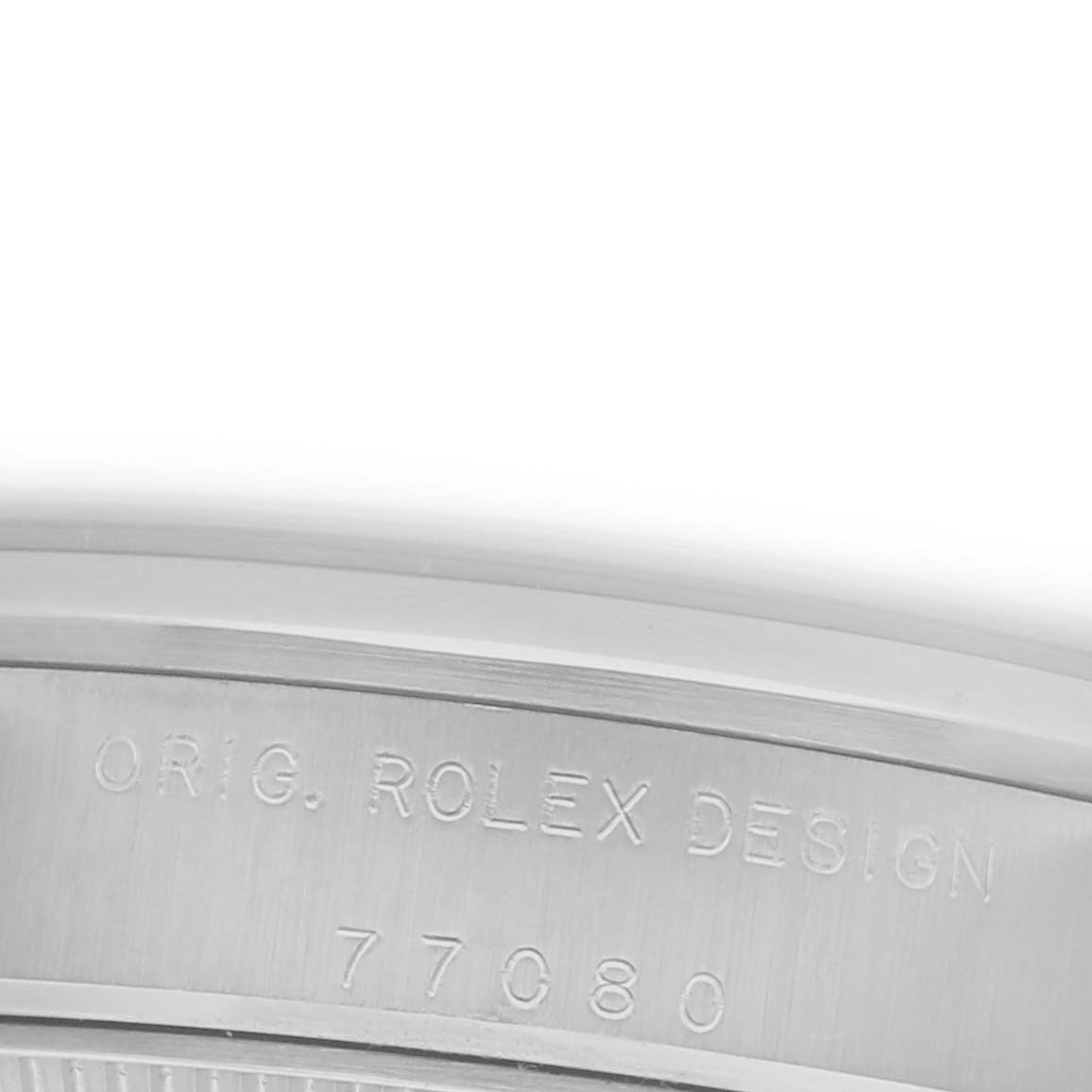The image shows a close-up view of the side engraving on a Rolex Oyster Perpetual model.