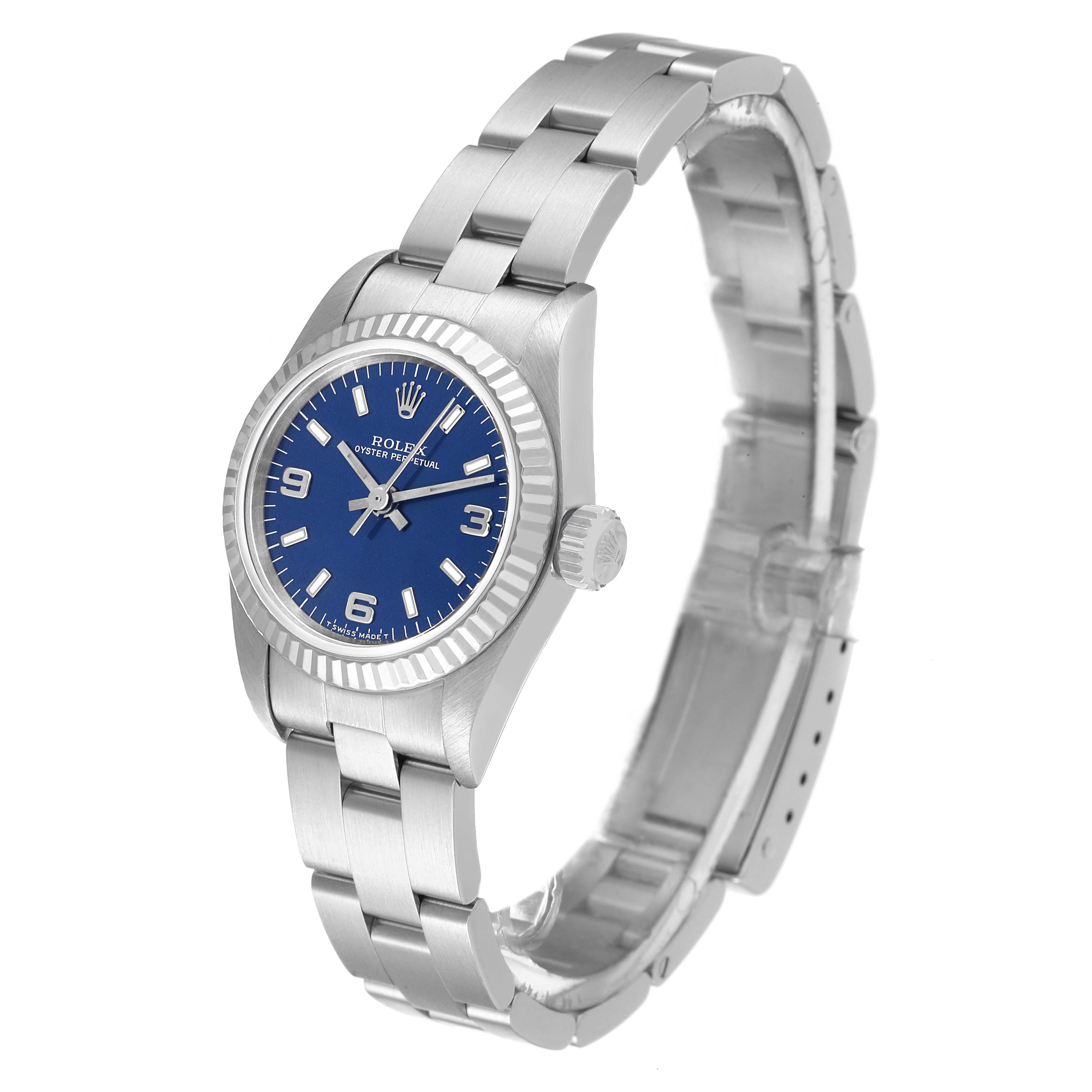 The Rolex Oyster Perpetual 67194 Women's Stainless Steel Blue Dial 67194 Women's Stainless Steel Blue Dial watch is shown at a three-quarter angle, displaying its blue dial, bezel, case, crown, and bracelet.