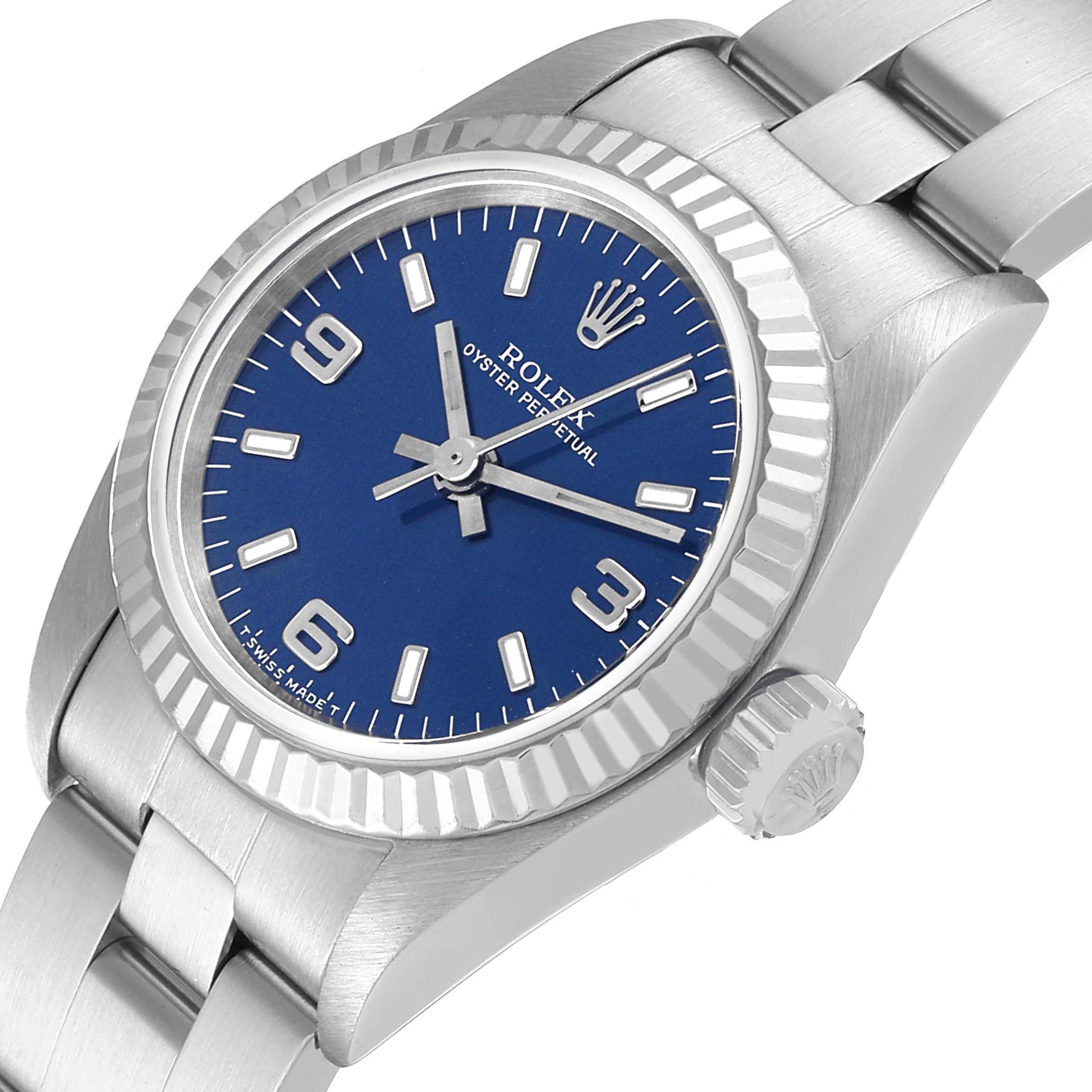 This Oyster Perpetual Rolex watch is shown at an angled view highlighting the blue dial, bezel, crown, and part of the bracelet.