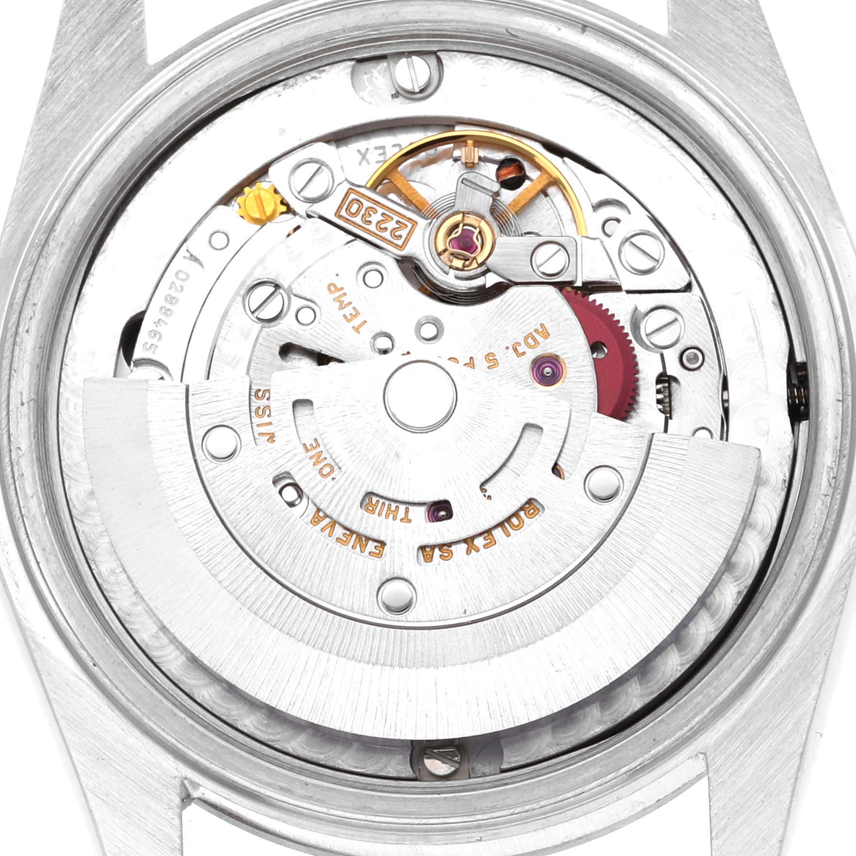 The image shows the back view of the movement mechanism inside a Mid-Size Rolex watch.