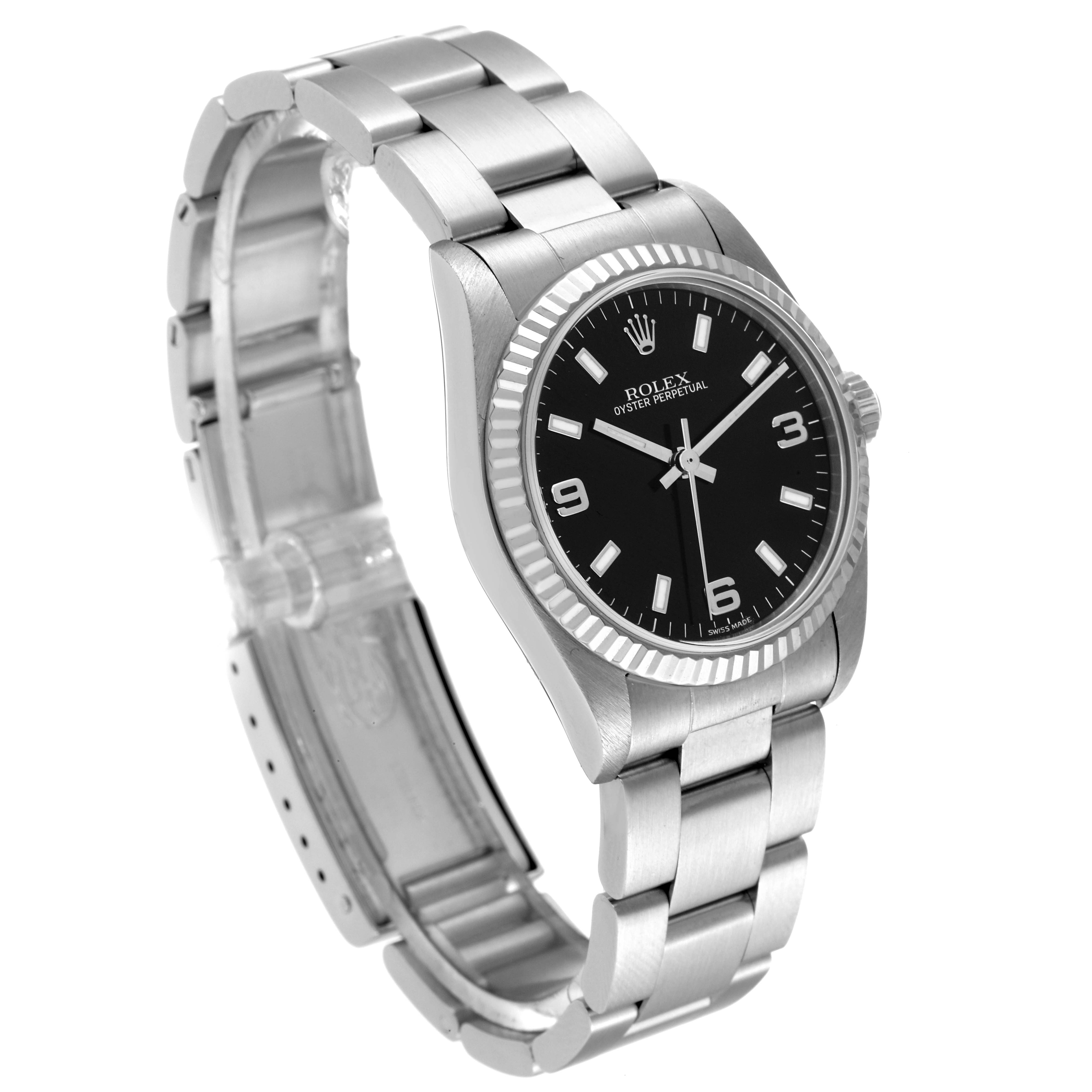 The image shows a side-angle view of the Rolex Mid-Size 77014 Women
s Stainless Steel Black Dial 77014 Women
s Stainless Steel Black Dial Oyster Perpetual watch, highlighting the dial, bezel, and bracelet.