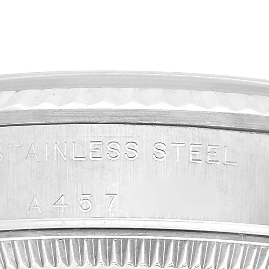 This image shows a close-up of the side engraving on the stainless steel case of a Rolex Mid-Size 77014 Women
s Stainless Steel Black Dial 77014 Women
s Stainless Steel Black Dial model watch.