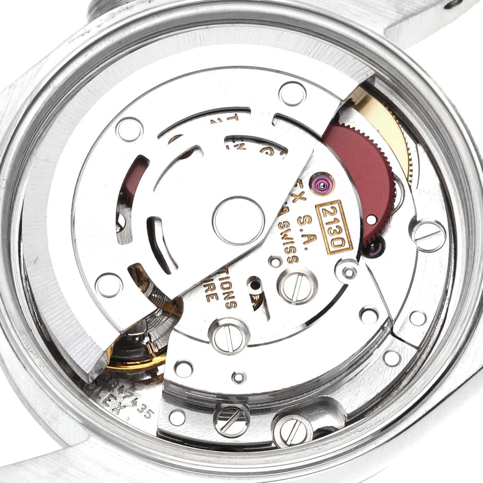 The image shows the movement and internal mechanism of a Rolex Oyster Perpetual 67180 Women's Stainless Steel Pink Dial 67180 Women's Stainless Steel Pink Dial watch at a top-down angle.