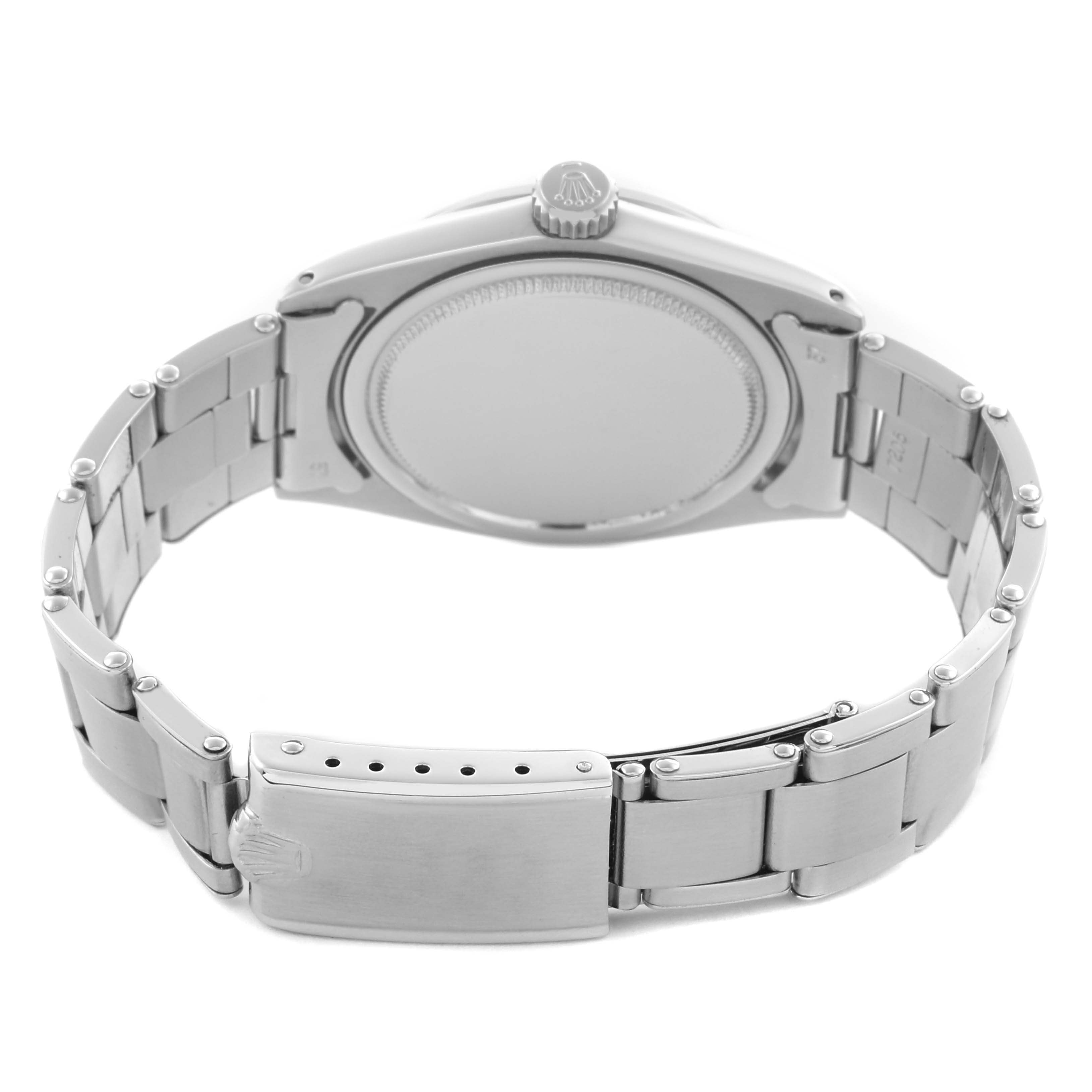 The image shows the back view of a Rolex Vintage Collection 6426 Men's Stainless Steel Silver Dial 6426 Men's Stainless Steel Silver Dial watch, highlighting the case back, crown, and partially opened bracelet clasp.