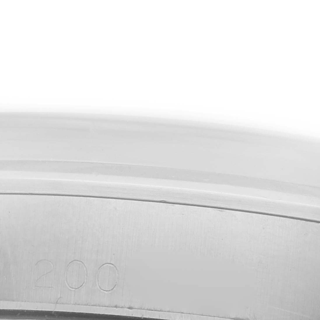 The image shows a close-up, angled view of the metal bezel of a Rolex Vintage Collection 6426 Men's Stainless Steel Silver Dial 6426 Men's Stainless Steel Silver Dial model.