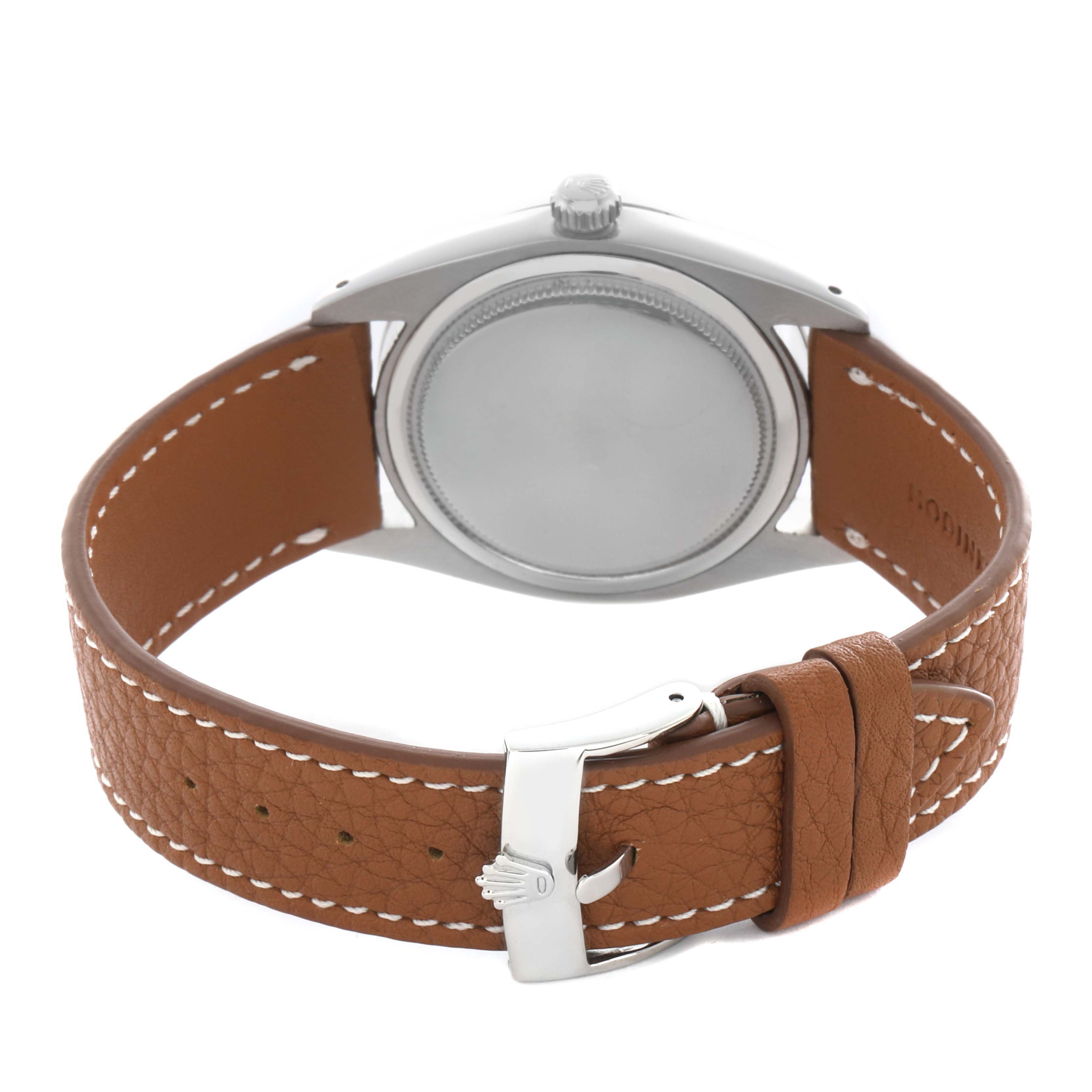 The image shows a Rolex Date 6694 Men's Stainless Steel Silver Dial 6694 Men's Stainless Steel Silver Dial model from the rear, highlighting the back case, crown, and brown leather strap.