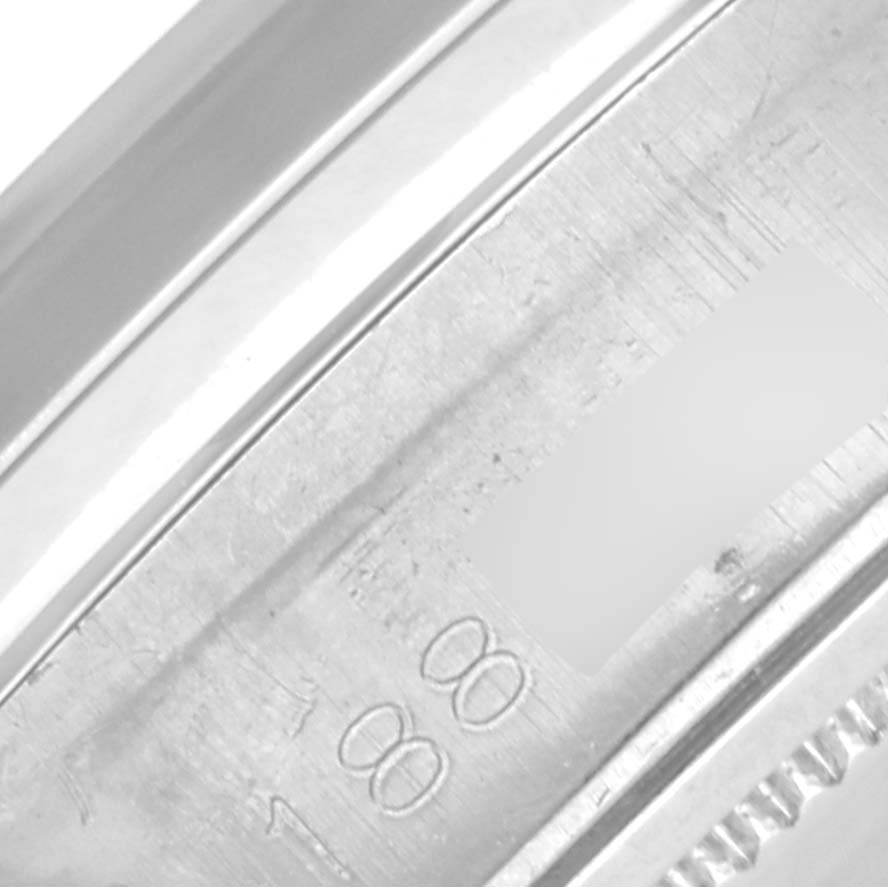 The image shows a close-up of the edge and side engravings on the bezel of a Rolex Date 6694 Men's Stainless Steel Silver Dial 6694 Men's Stainless Steel Silver Dial model watch.