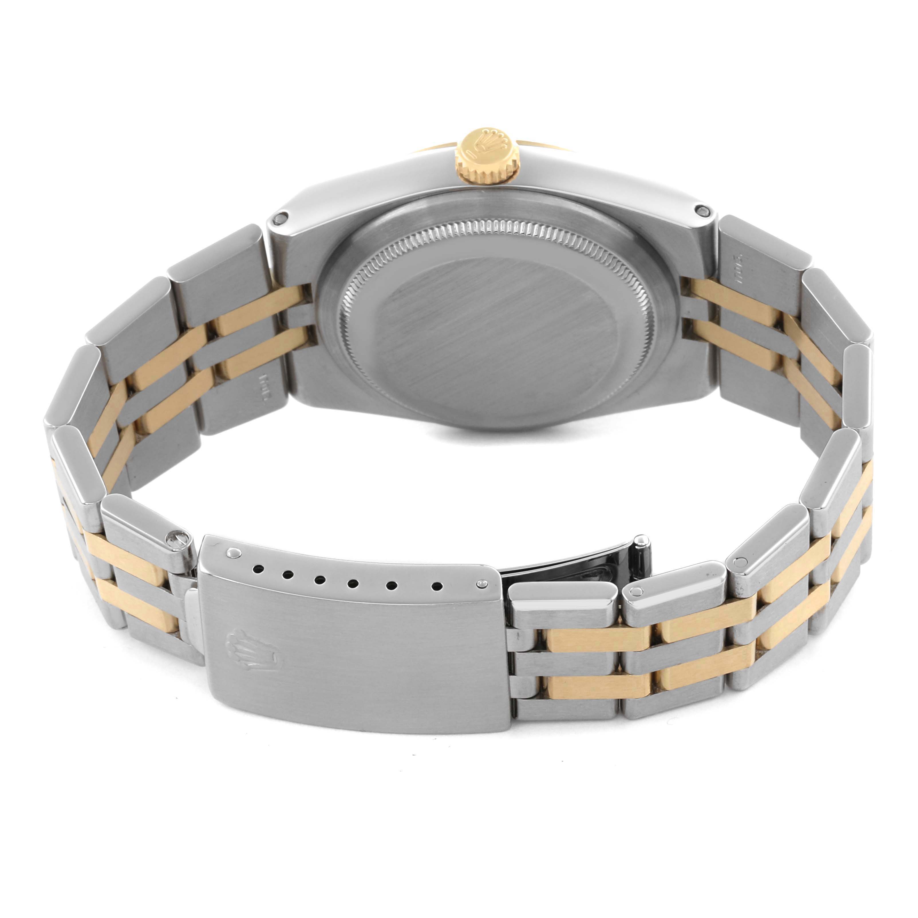 The Rolex Oysterquartz 17013 Men's Steel and Gold (two tone) Champagne Dial 17013 Men's Steel and Gold (two tone) Champagne Dial watch is shown from the back, highlighting the case back, crown, and two-tone bracelet clasp.