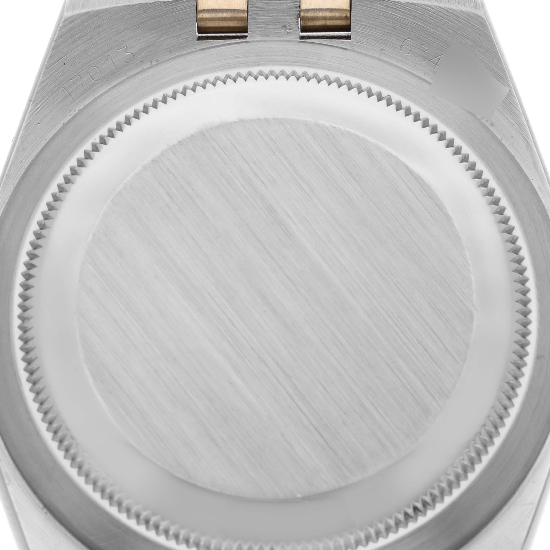 The image shows the case back of a Rolex Oysterquartz 17013 Men's Steel and Gold (two tone) Champagne Dial 17013 Men's Steel and Gold (two tone) Champagne Dial watch from a top-down angle.