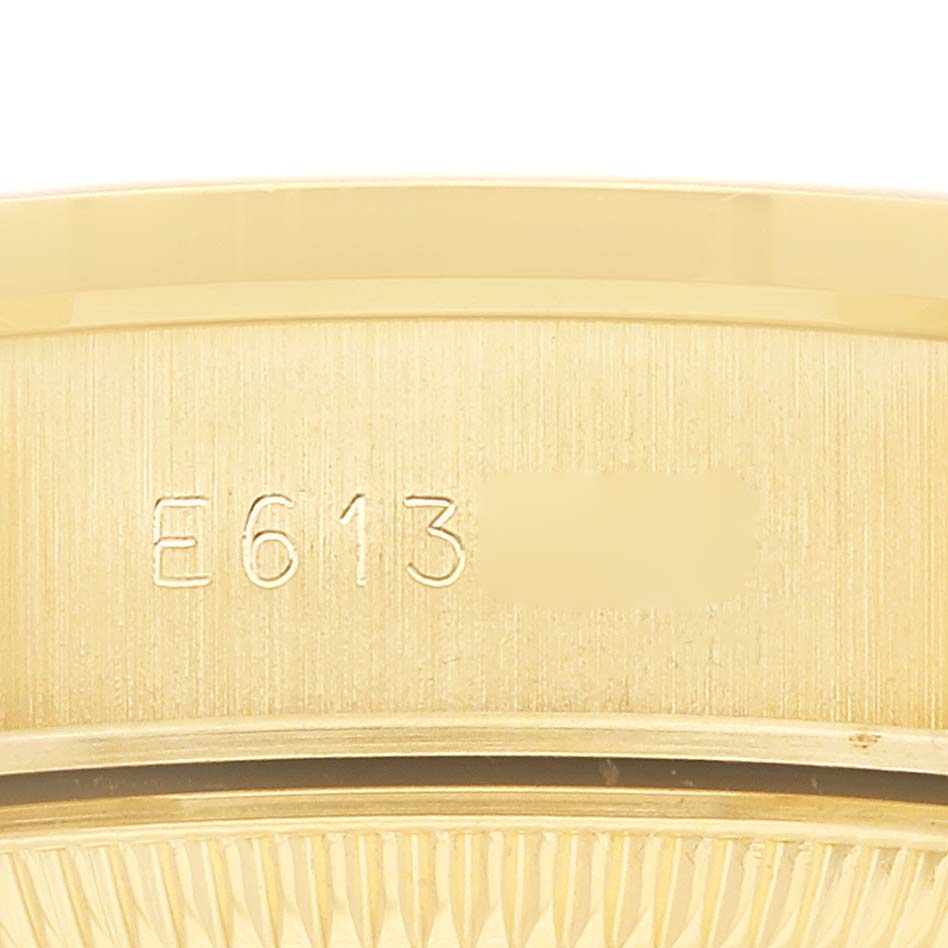 The image shows a close-up of the side of a Rolex President 69138 Women's Yellow Gold Champagne Dial 69138 Women's Yellow Gold Champagne Dial watch case, highlighting the engraved model number.