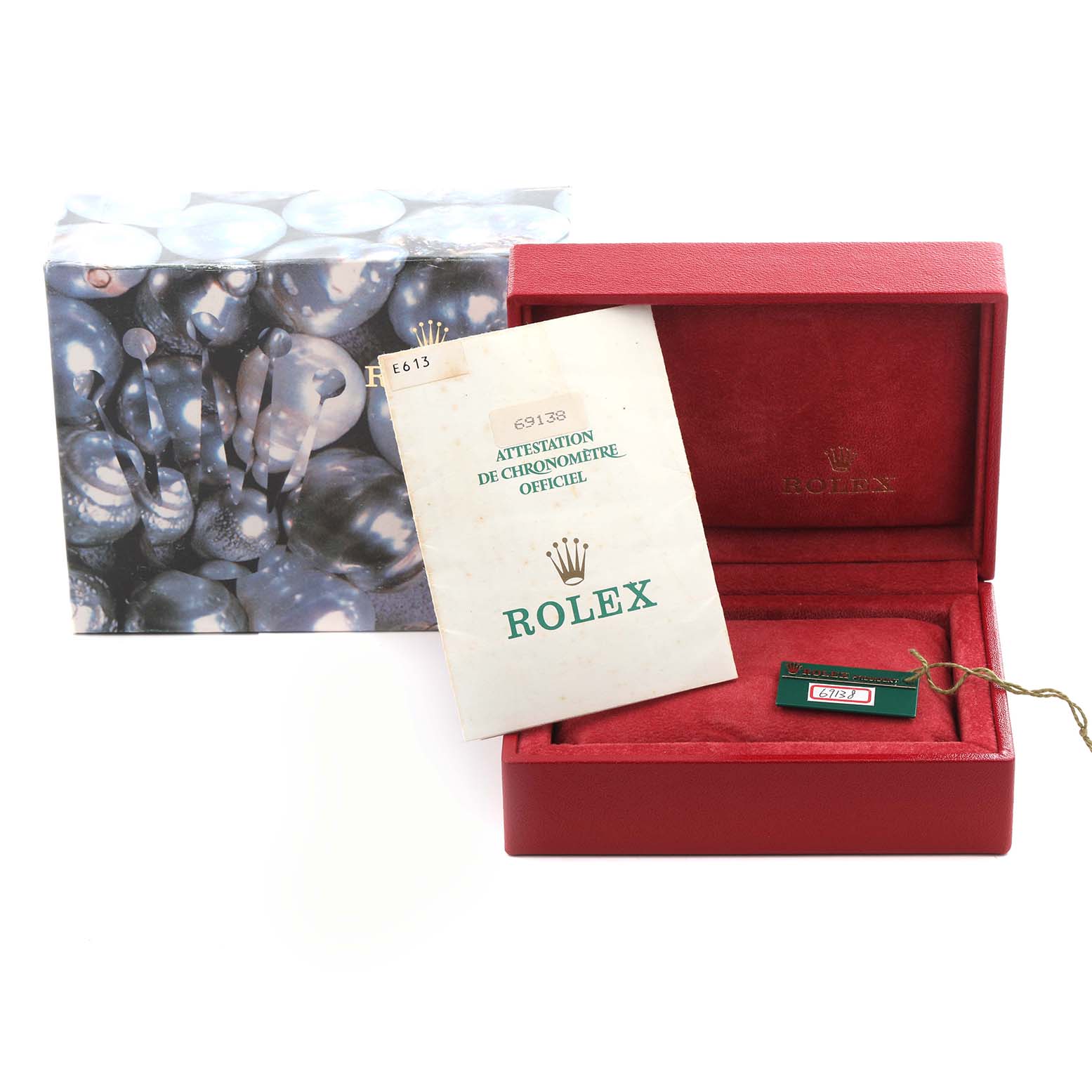 The image shows a Rolex President 69138 Women's Yellow Gold Champagne Dial 69138 Women's Yellow Gold Champagne Dial model watch box and accessories, including a certificate and tag.