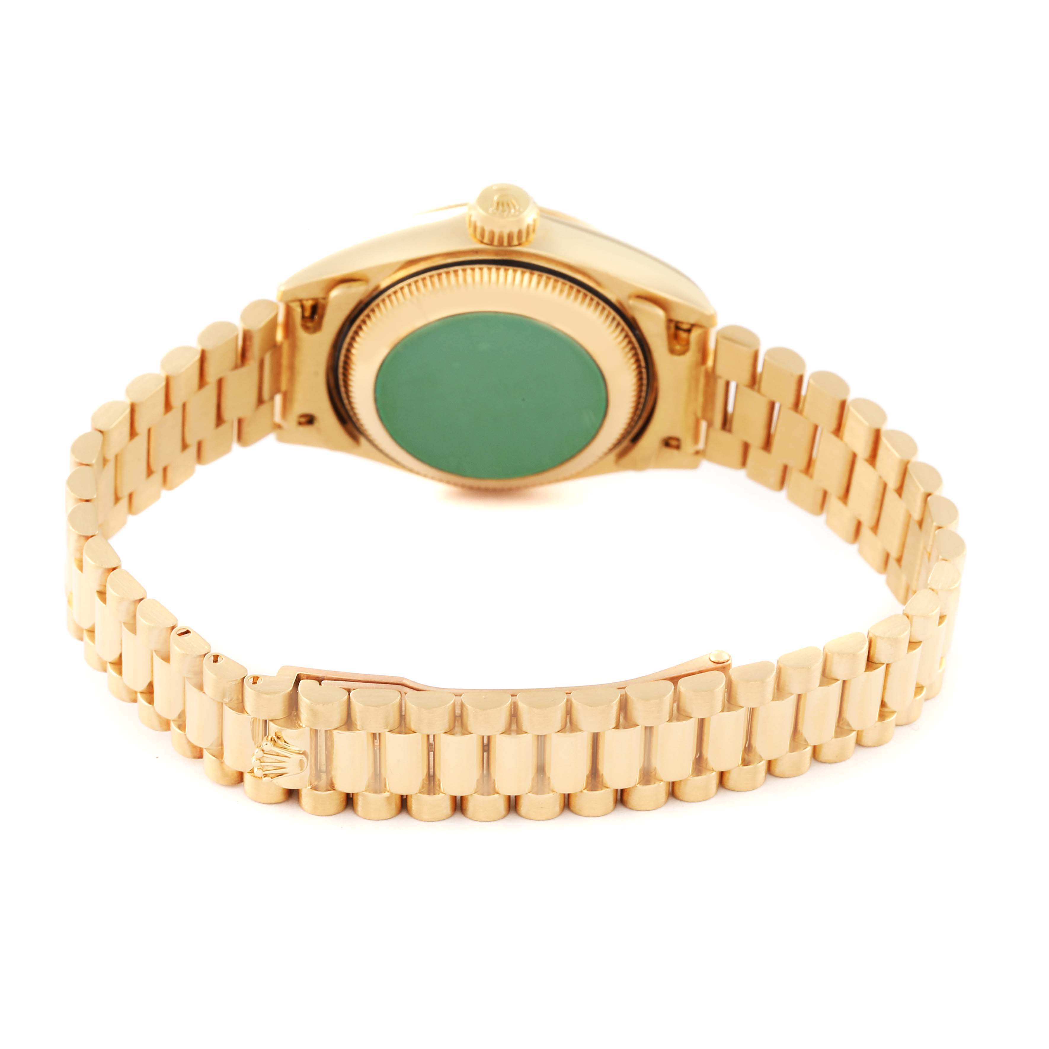 The image shows the back and bracelet of a Rolex President 69178 Women
s Yellow Gold Champagne Dial 69178 Women
s Yellow Gold Champagne Dial model watch, showcasing its gold finish and clasp.