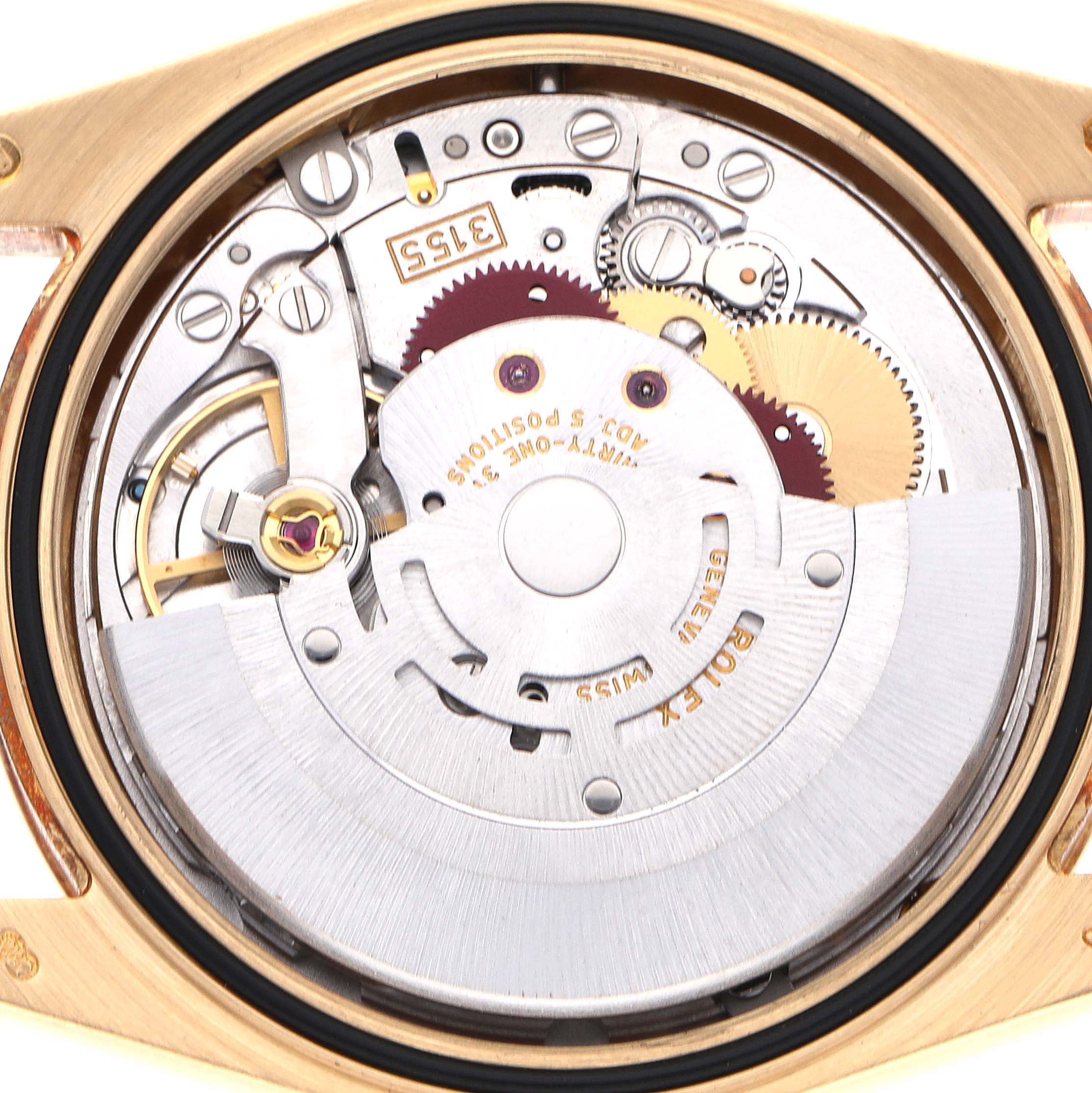 The image shows the movement of a Rolex President 118388 Men's Yellow Gold Mother of Pearl Dial 118388 Men's Yellow Gold Mother of Pearl Dial watch from a top-down angle, showcasing its intricate gears and components.