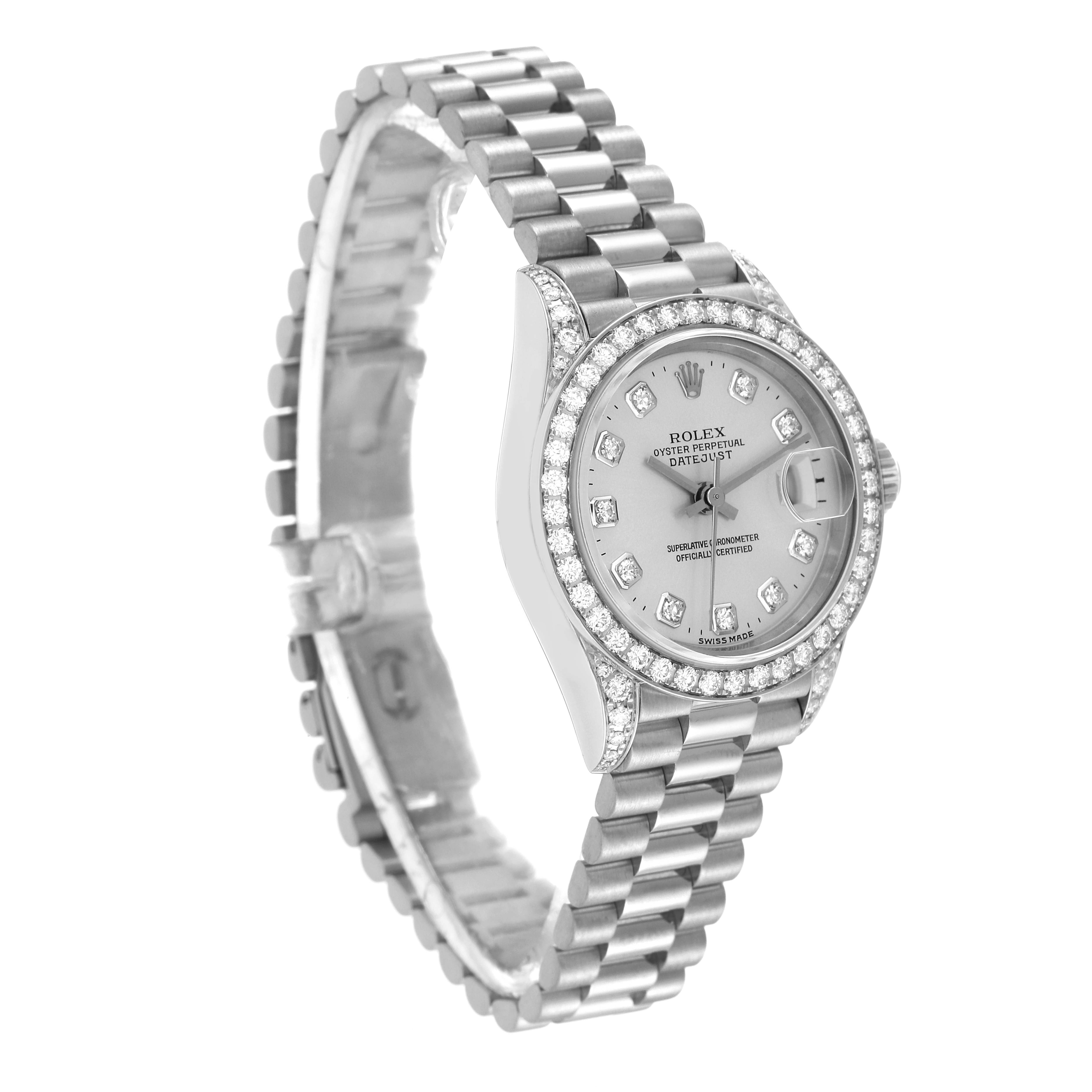 The Rolex President 79159 Women's White Gold Silver Dial 79159 Women's White Gold Silver Dial model watch is shown at an oblique angle, highlighting its face, bracelet, and diamond-encrusted bezel.